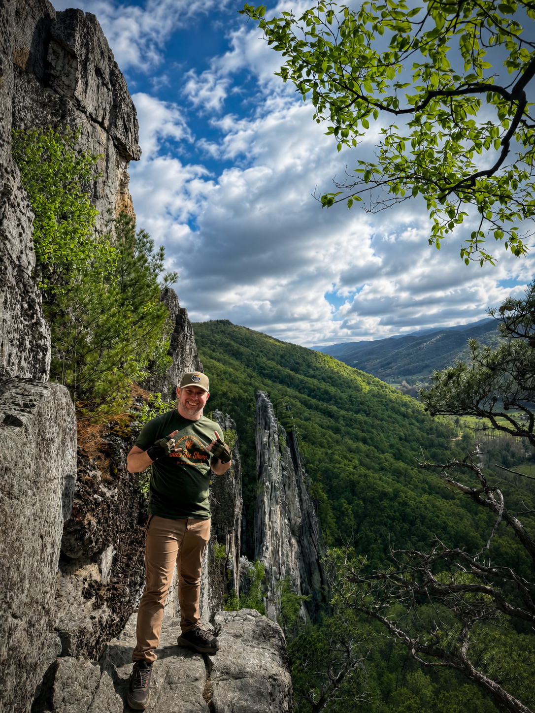 Rebellious adventure portrait at Seneca Rocks, framed by the rugged West Virginia landscape.