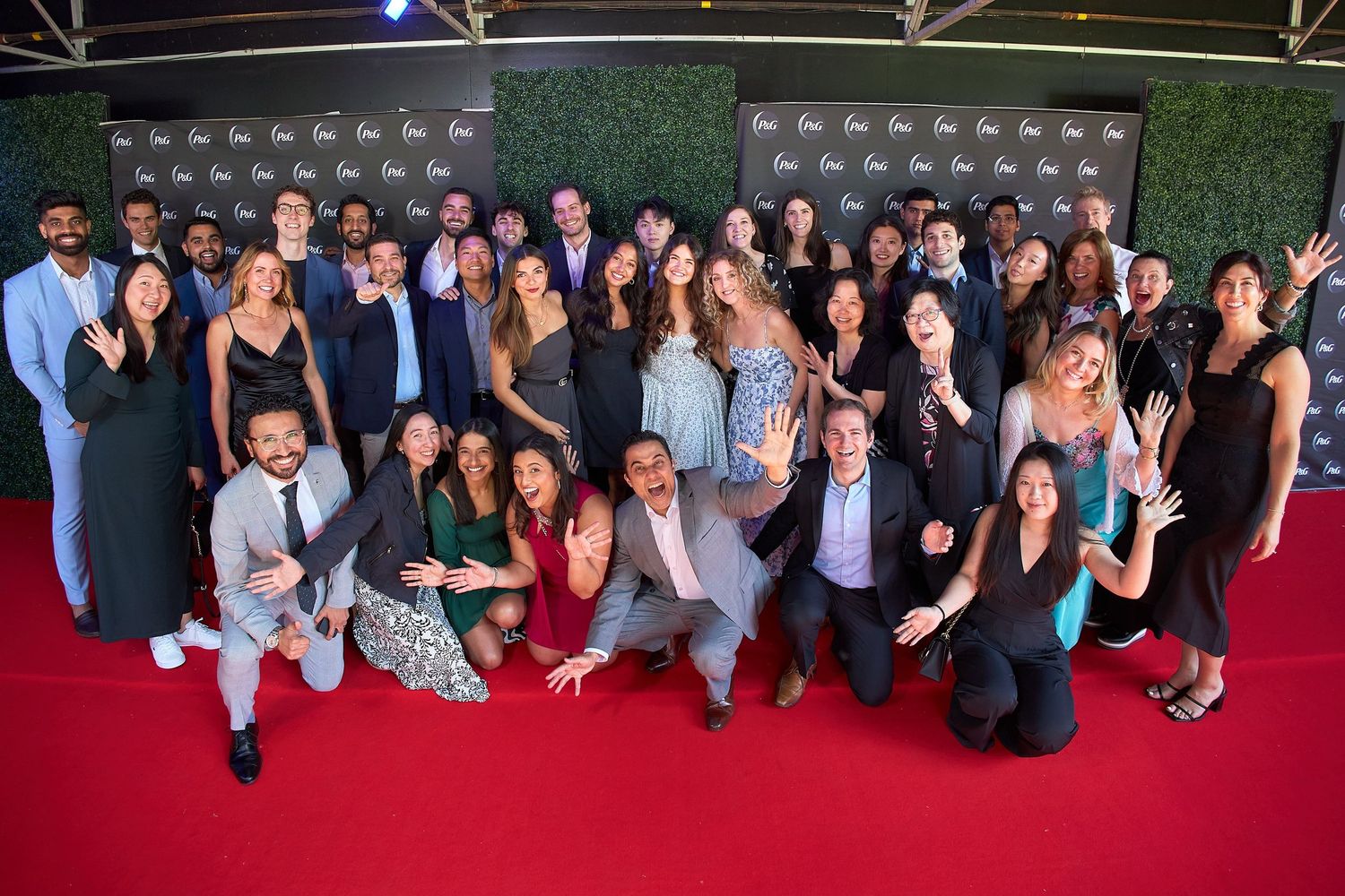 Dynamic group shot of team members at a corporate awards ceremony