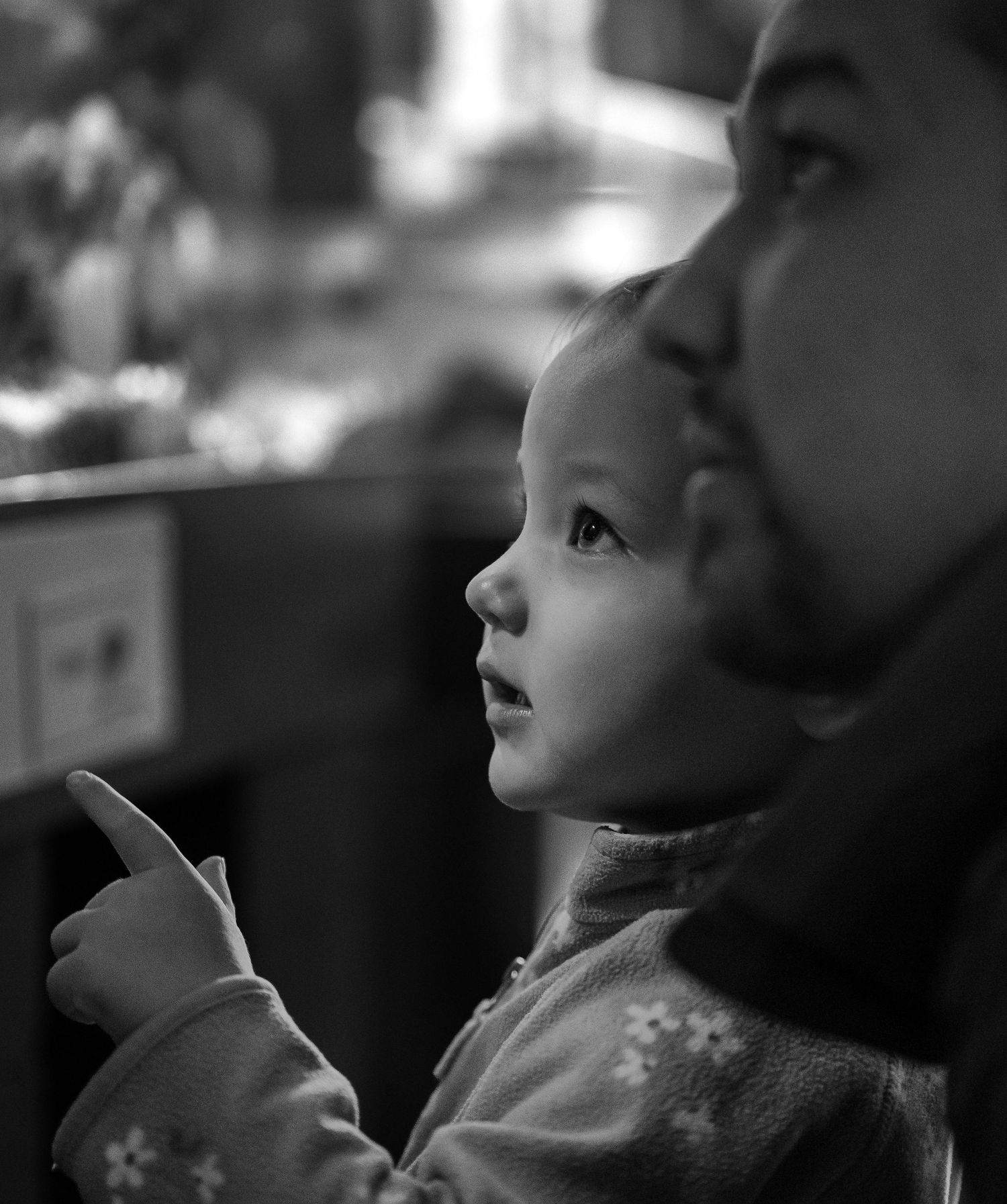 A little girl pointing. Black and white.