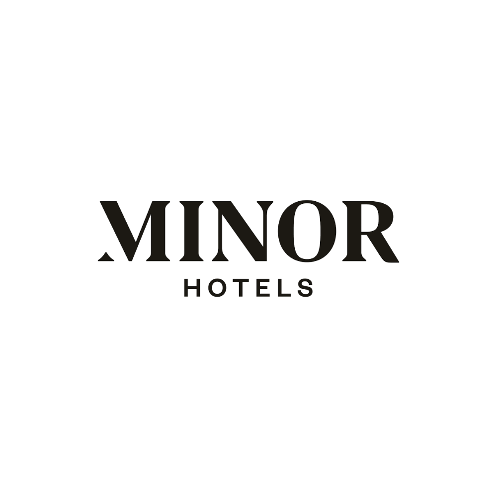 Minor Hotels logo in bold black serif typography with a distinctive arrow detail on white background.
