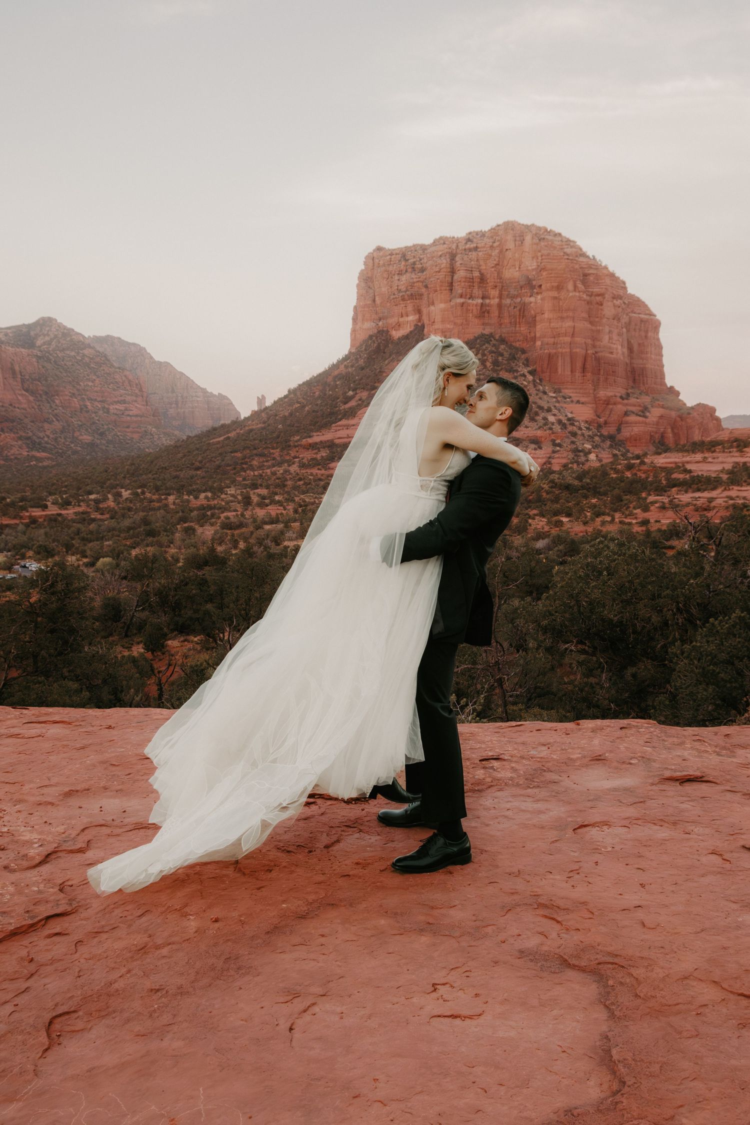Sedona Arizona elopement photography featuring newlyweds surrounded by beautiful red rock scenery.