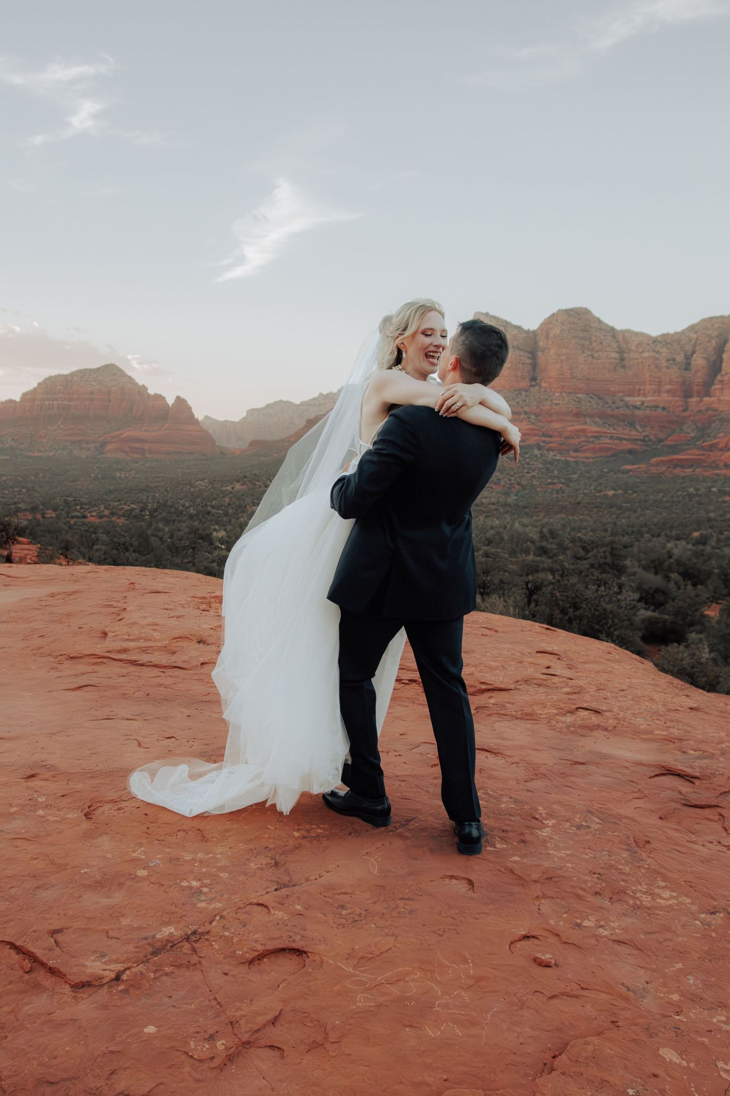 Arizona desert elopement photography featuring a newlywed couple surrounded by dramatic Southwest scenery.