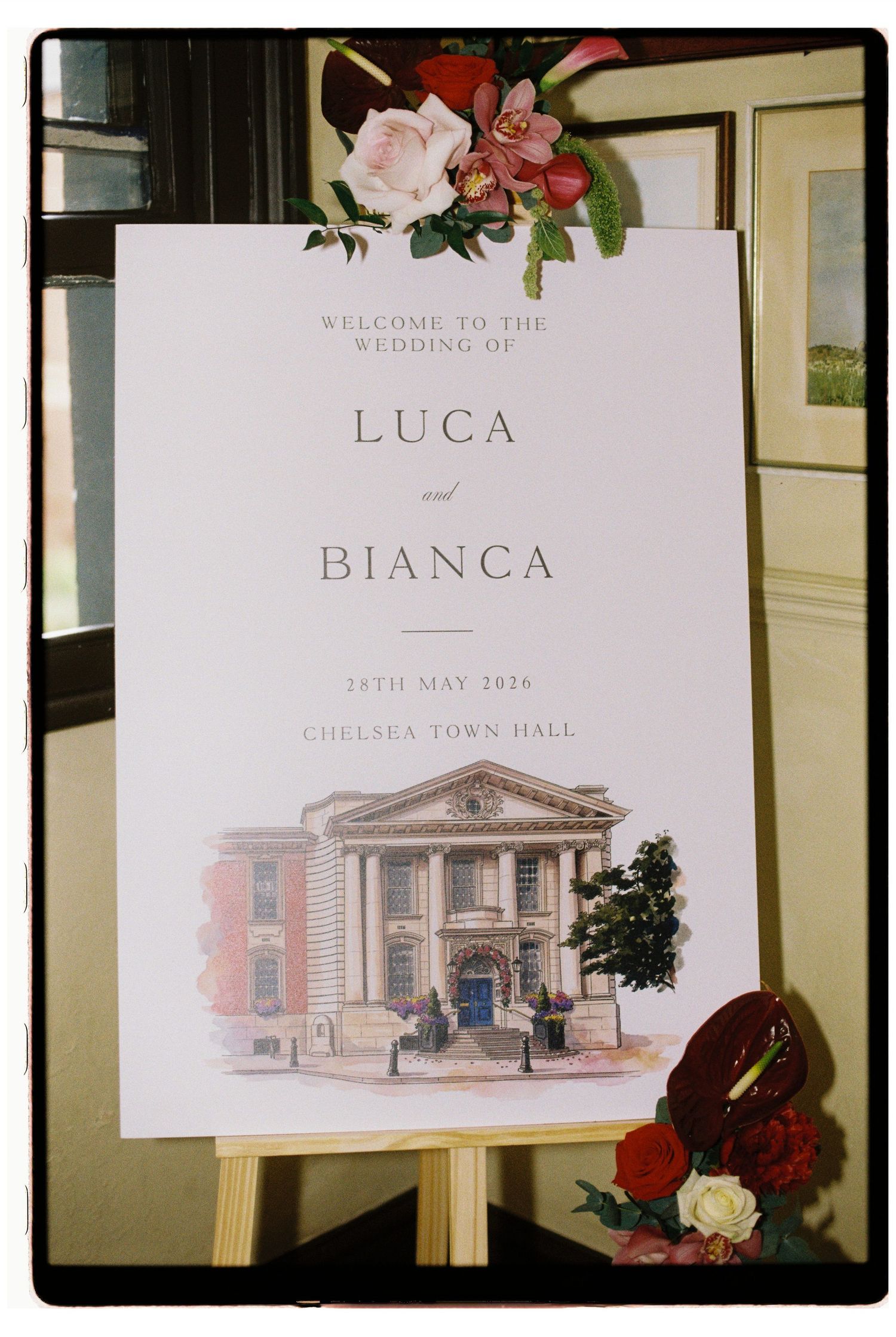 Wedding welcome sign for Luca and Bianca at Chelsea Town Hall on 24th May 2026 with floral decor.