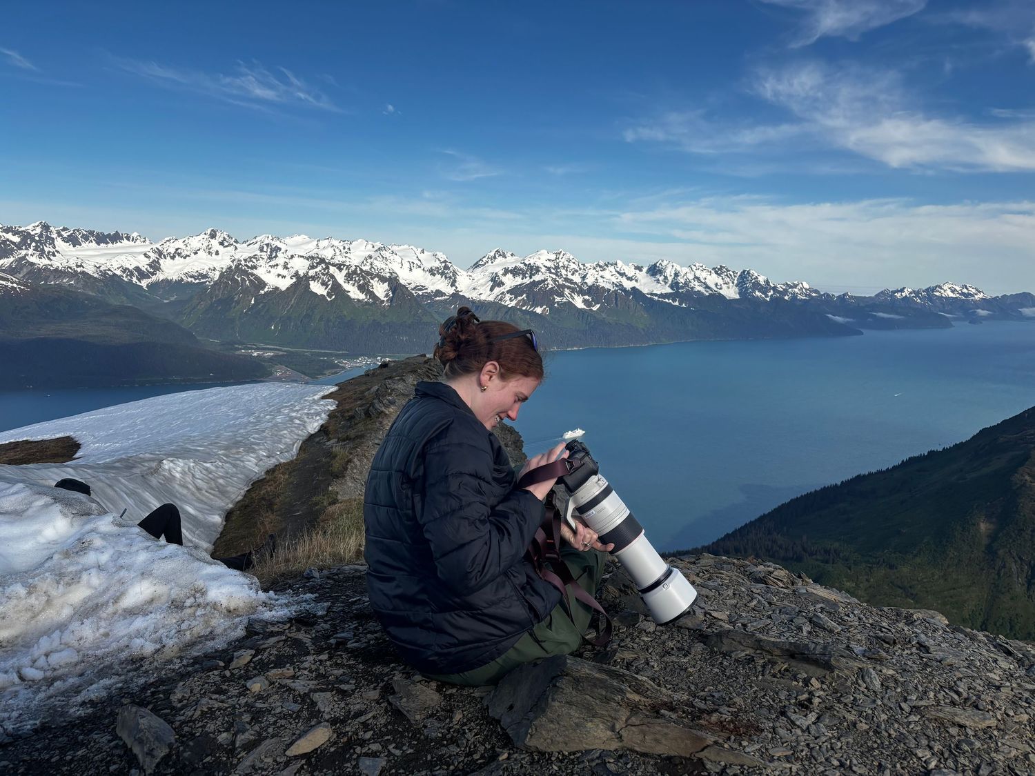 Photographer on top of a mountain taking pictures