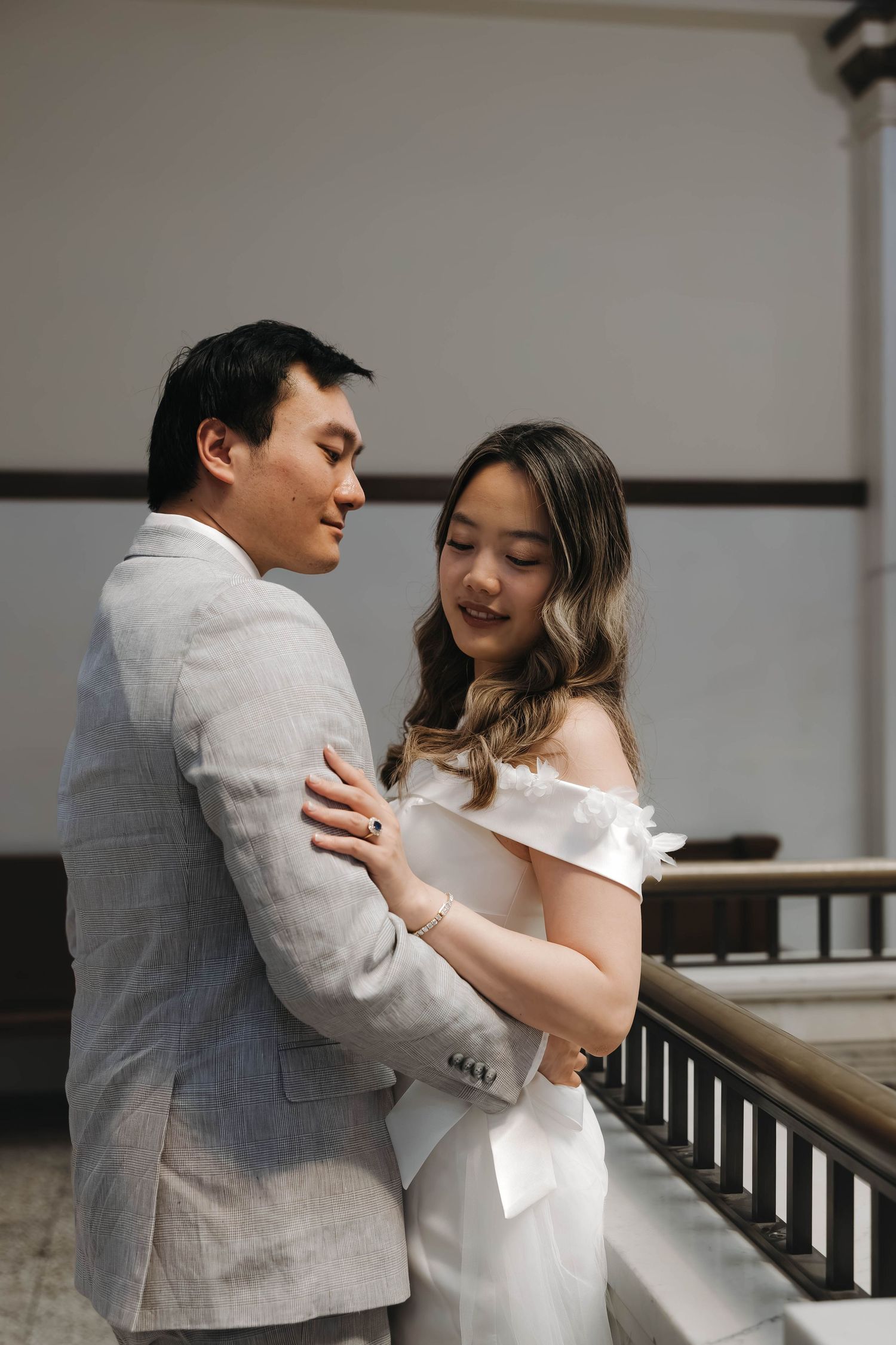 Bride and groom walking through downtown Omaha after their ceremony
