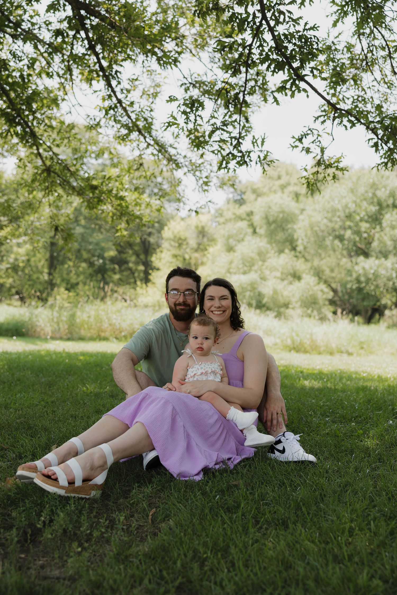 Parents holding their child during an outdoor family session