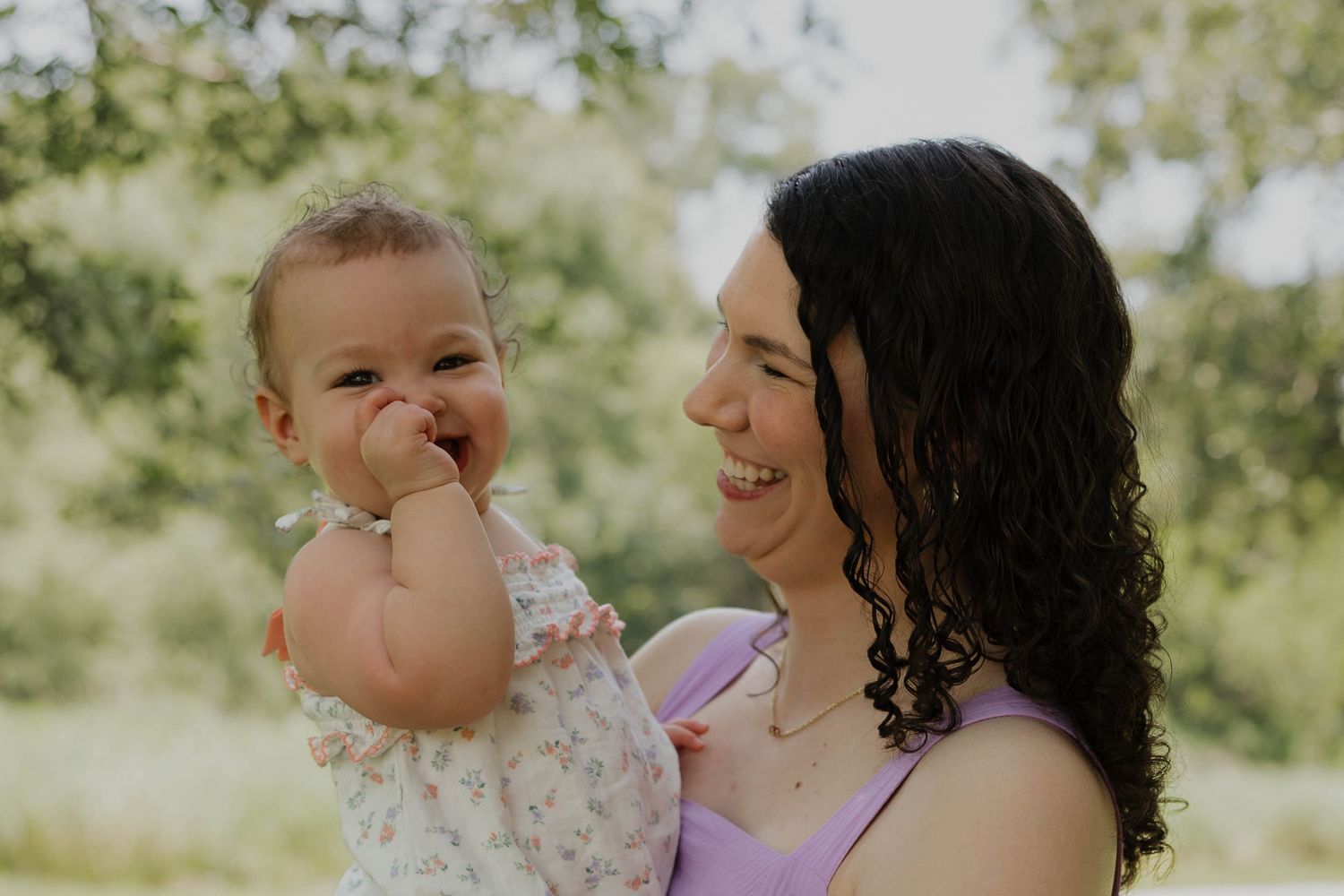 Mother holding her young child during an outdoor family session