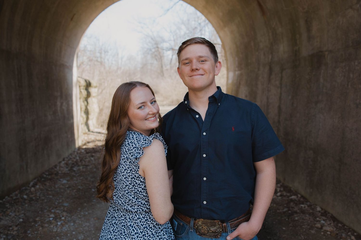 Couple posing while exploring an outdoor setting