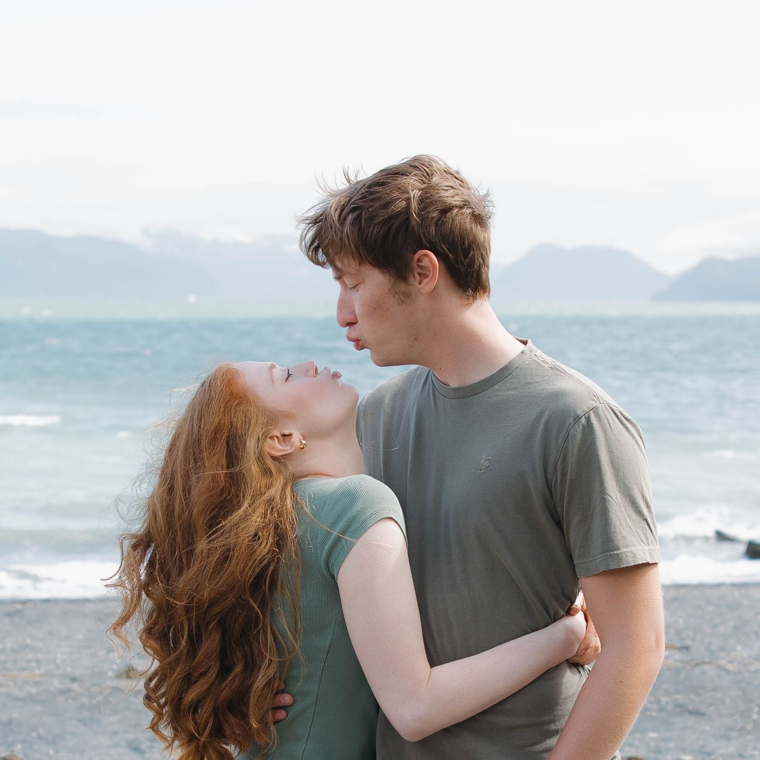 Couple enjoying a playful moment together outdoors in Alaska