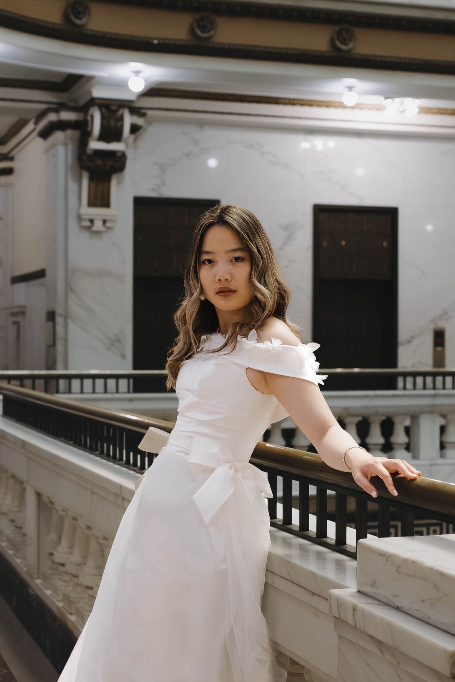Bride posing inside the Omaha courthouse during her wedding portraits