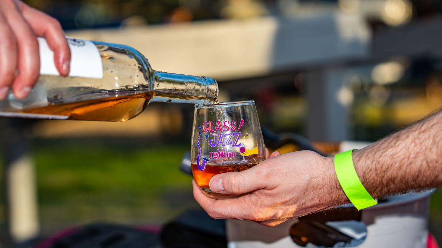 Wine being poured into a Glass of Jazz event glass