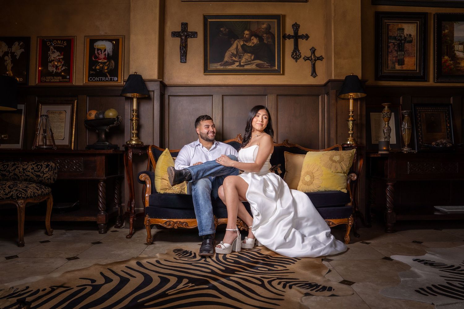 Engaged couple posing together in an elegant indoor setting