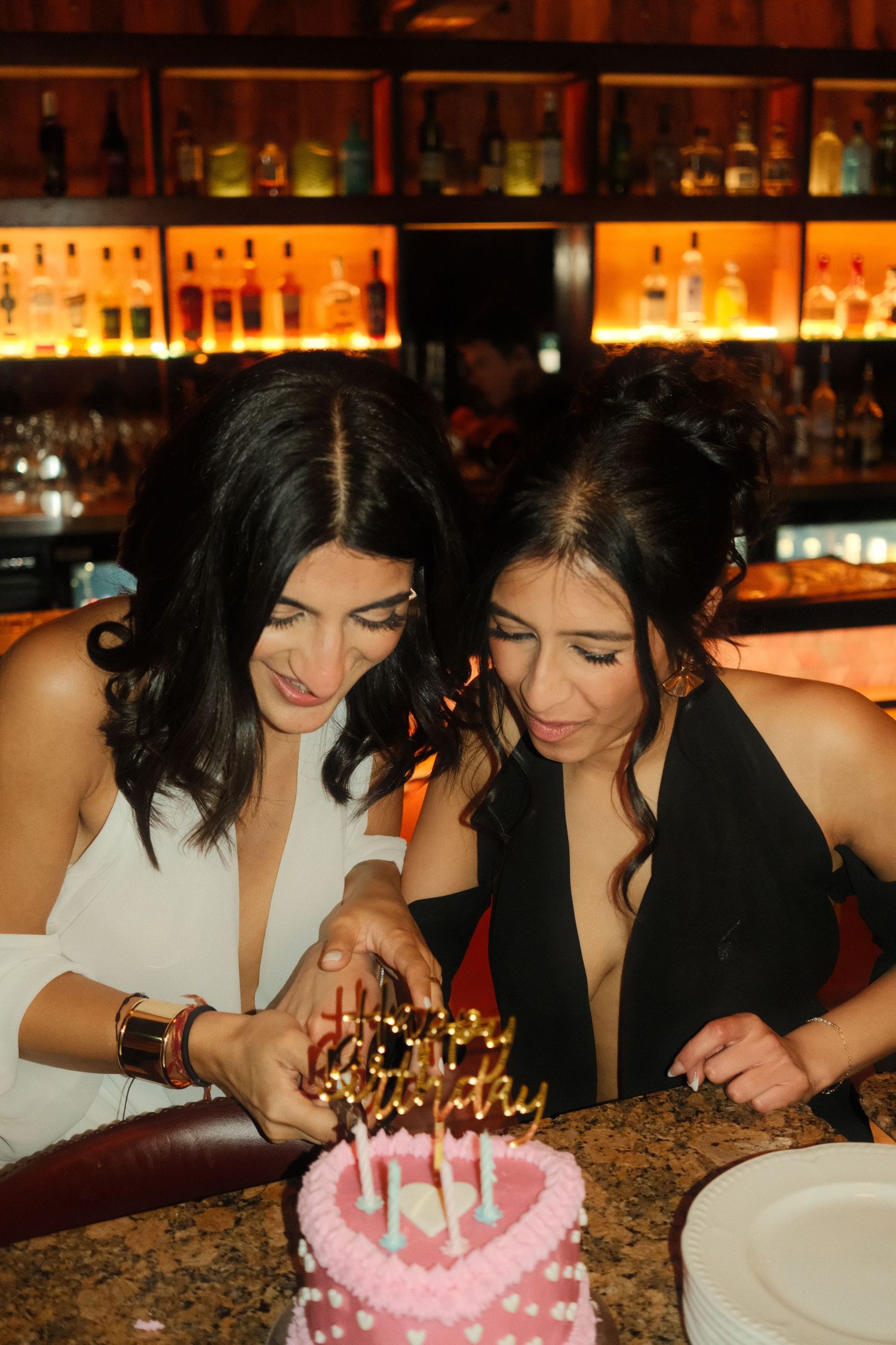 Candid moment from a birthday event capturing genuine joy and connection.