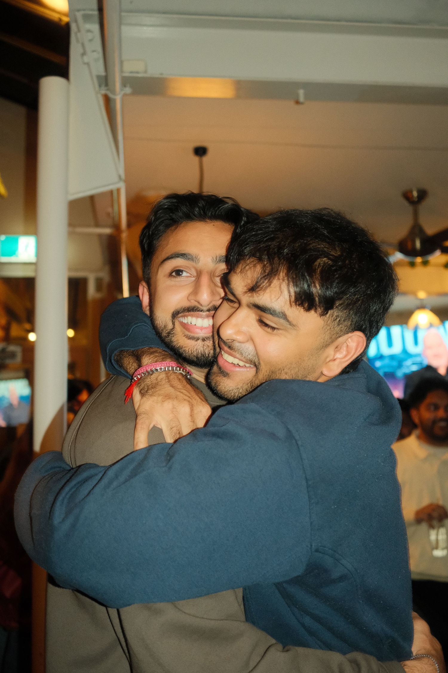 Candid moment from a birthday event capturing genuine joy and connection.