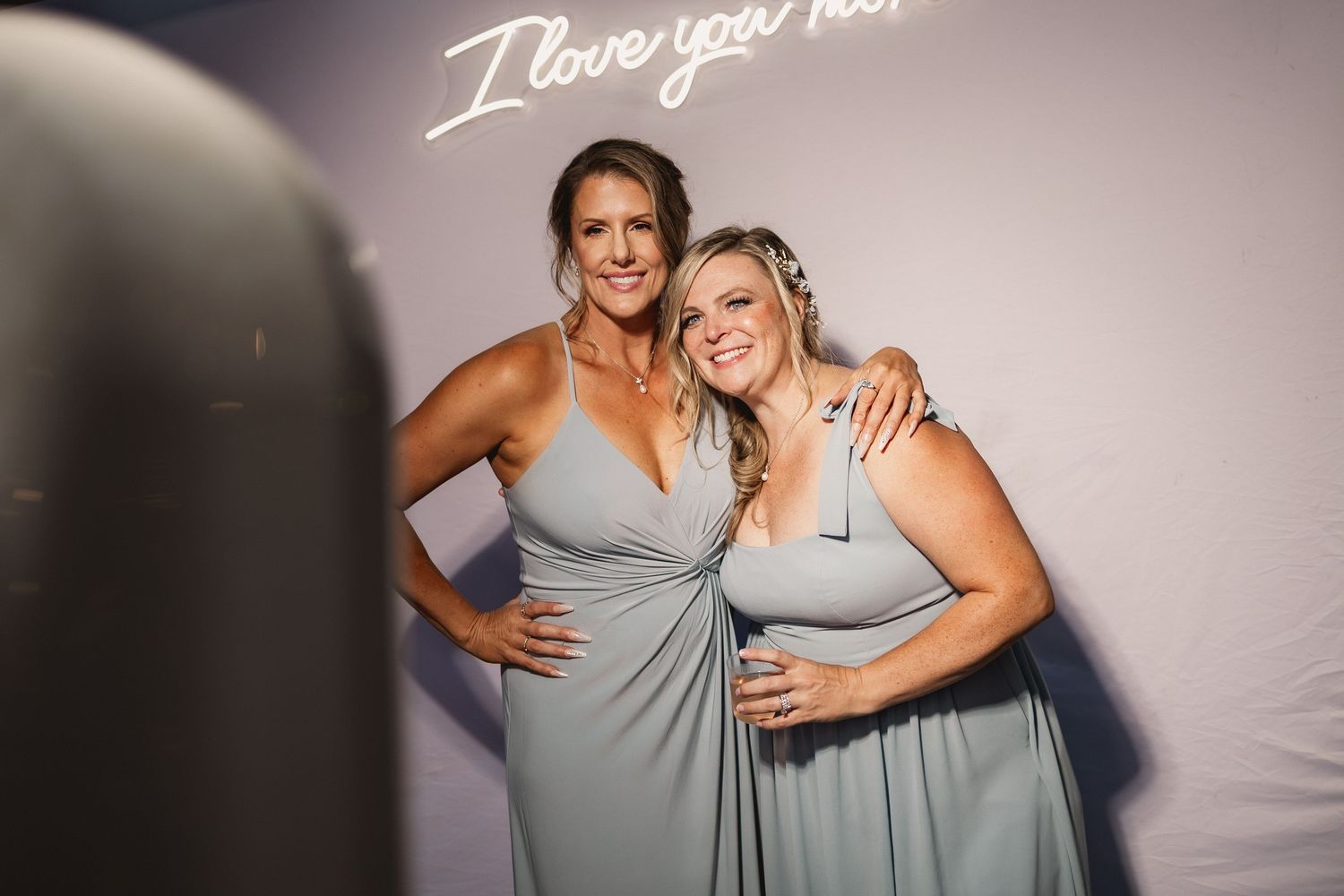 A series of wedding party photos showing bridesmaids in light gray dresses posing together against a neutral background.