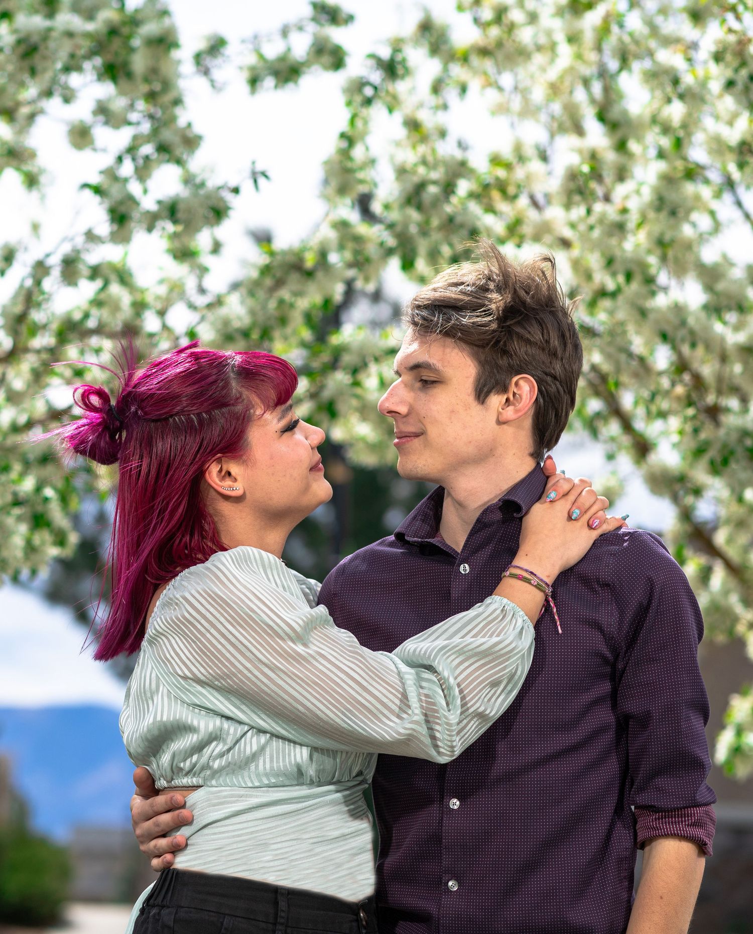 Spring couples portrait session with blooming flowers by a Colorado Springs portrait photographer.