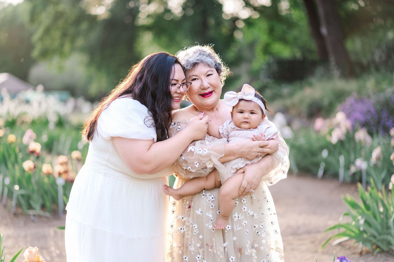 A collection of candid outdoor family photos taken in a garden with blooming flowers and natural lighting.