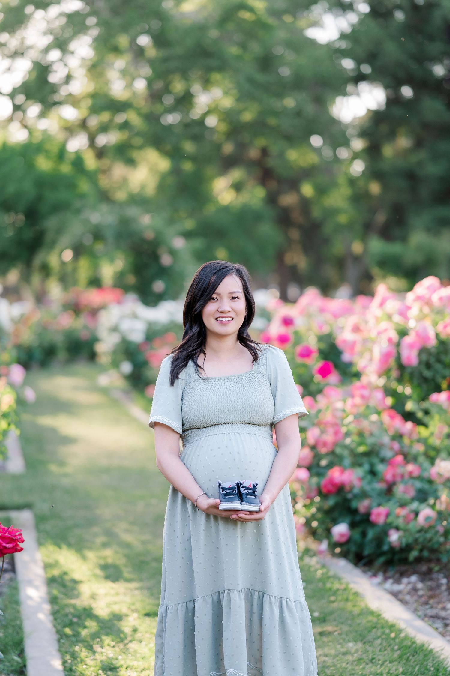 A sequence of photos shows a person in a light gray dress posing in a garden with blooming pink roses.