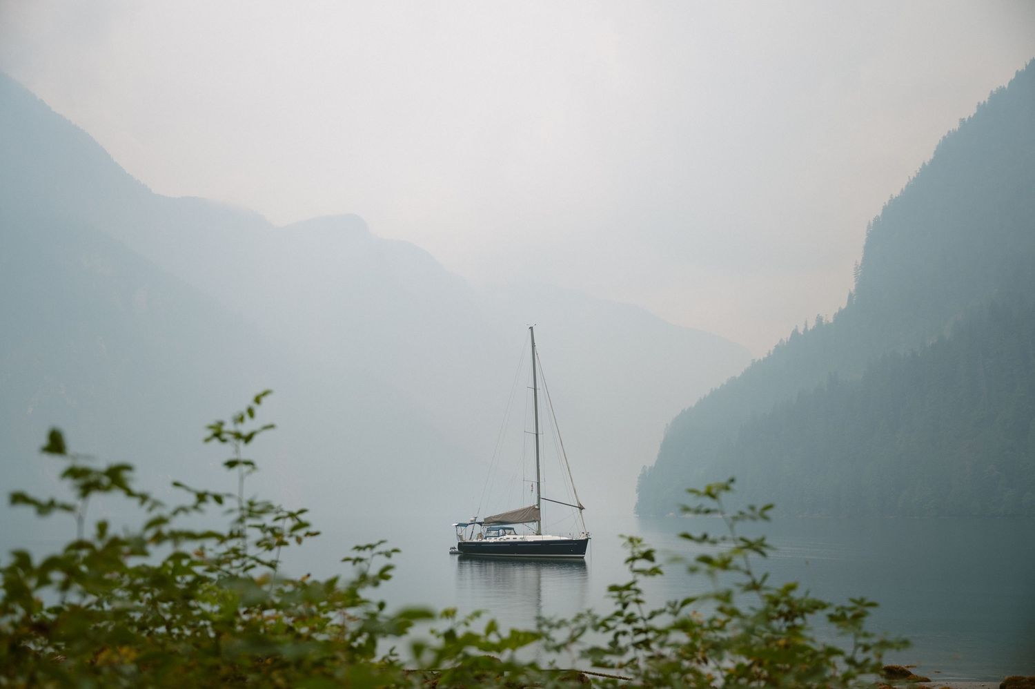 Vancouver Island Photographer.  Sailboat in the mist on the BC Coast