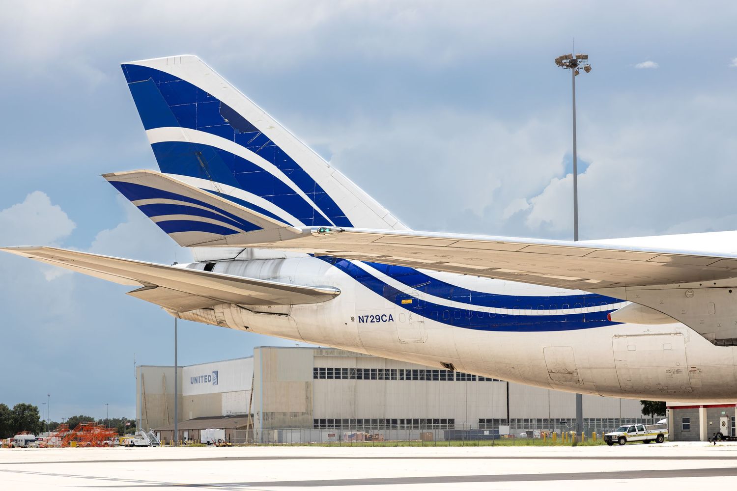 Copa Airlines aircraft tails lined up on tarmac at sunny airport, showcasing blue and white livery design.