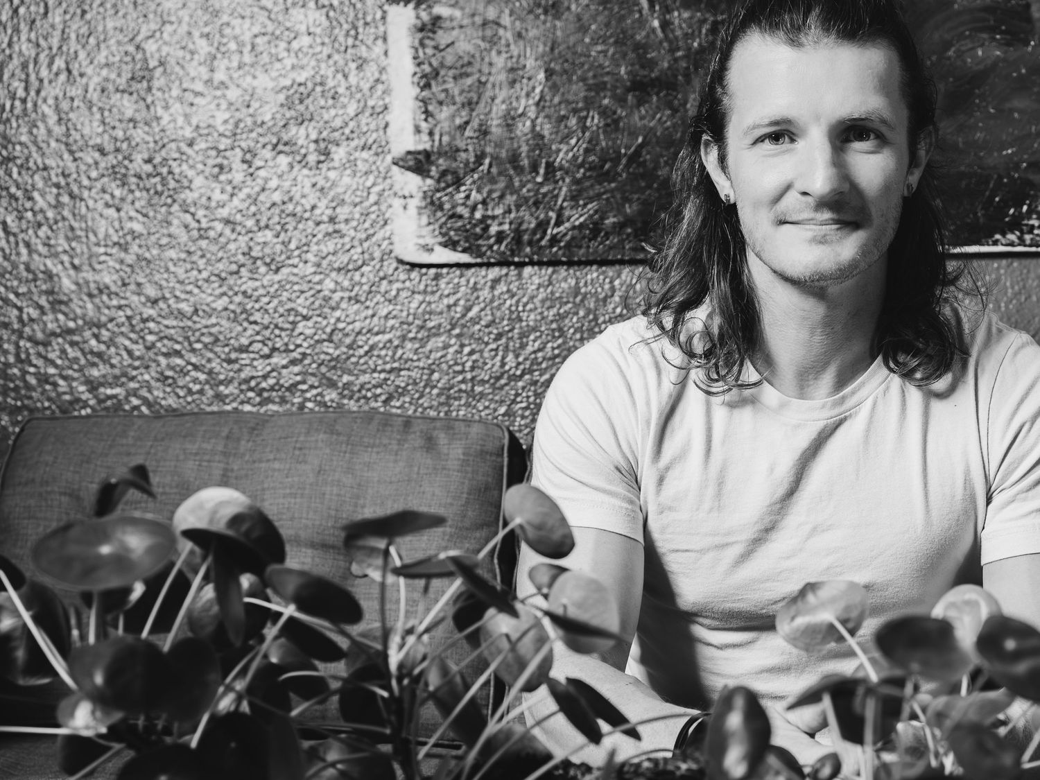 A collection of black and white photographs showing people in casual settings arranged in a horizontal row.