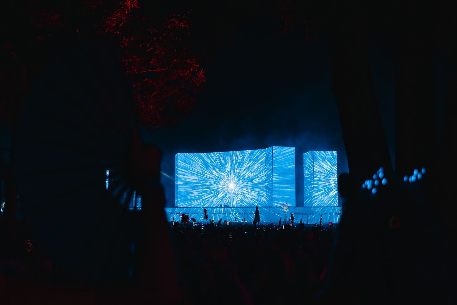 Blue neon lights illuminate a dark room creating an atmospheric cyberpunk aesthetic effect.