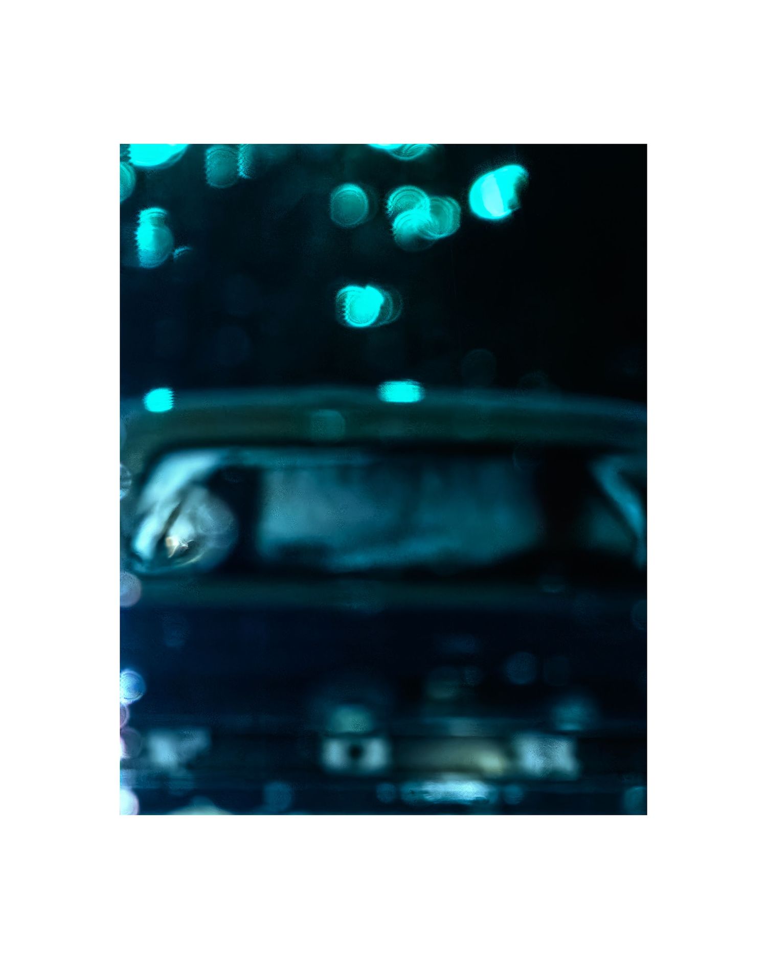 A blurry nighttime photo of a car surrounded by glowing cyan bokeh lights in a dark, moody urban setting.
