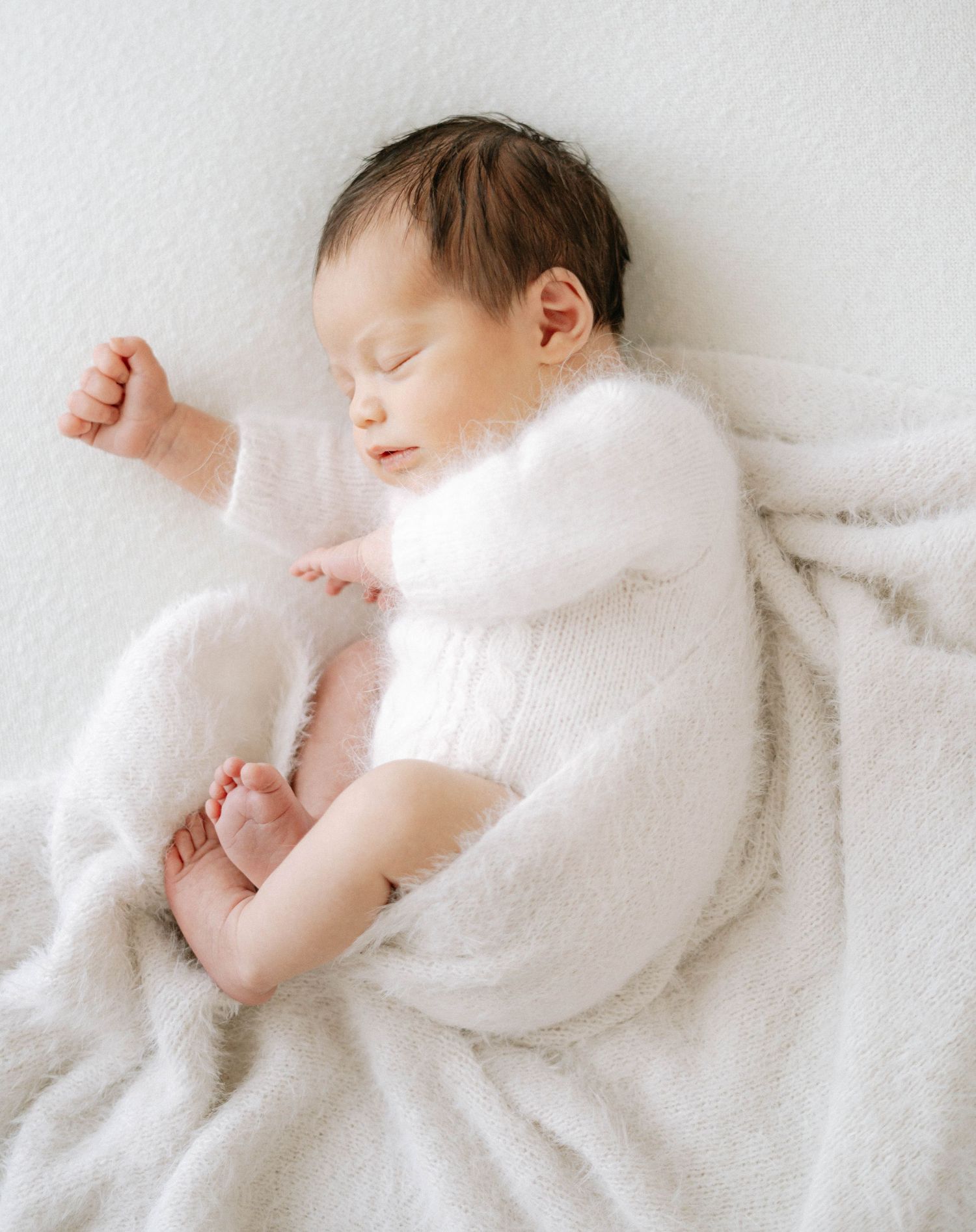Newborn, maternity, and family photography in a cozy, spa-like studio experience in Devon, offering relaxed and intimate sessions