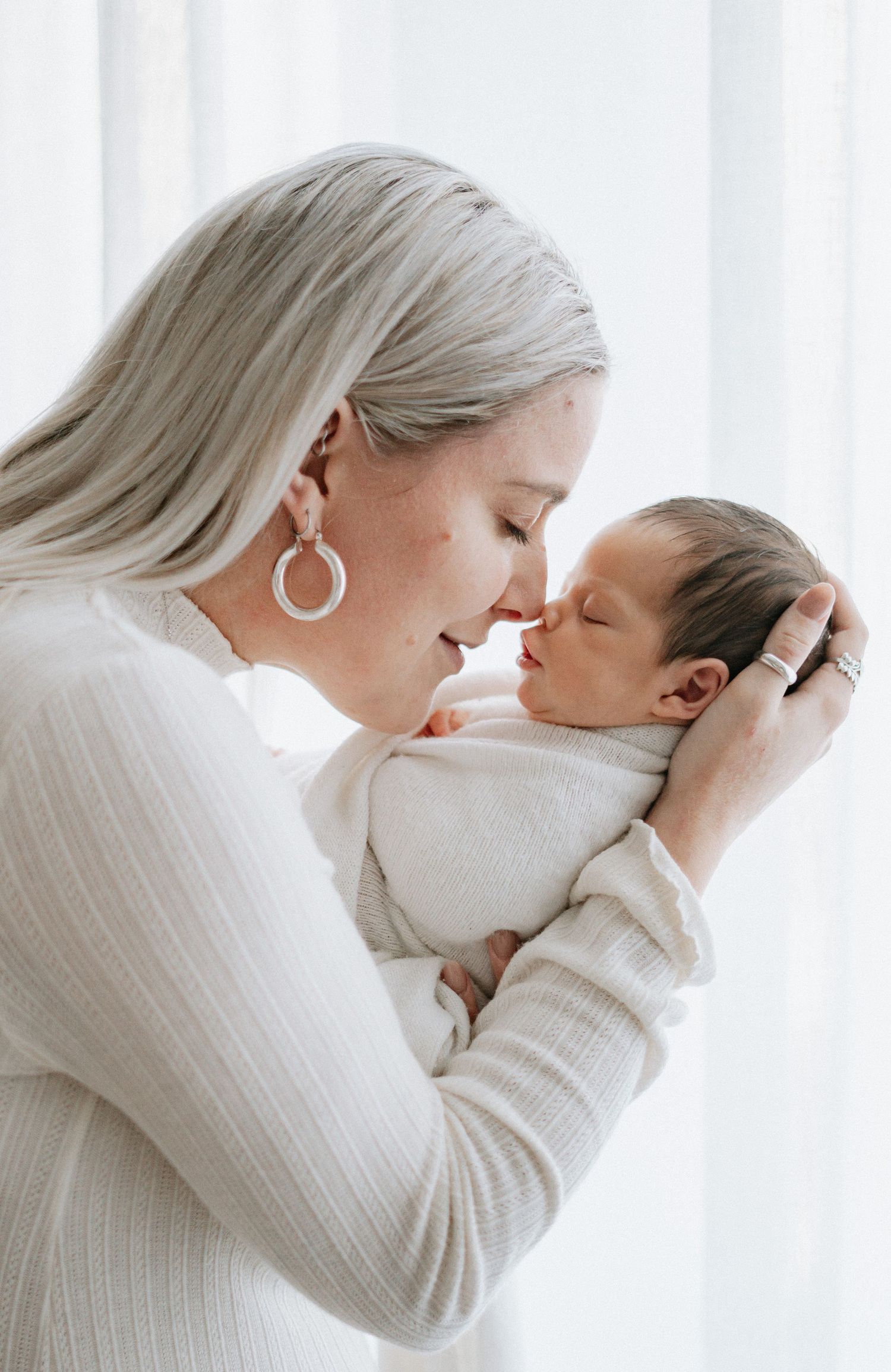 Newborn, maternity, and family photography in a cozy, spa-like studio experience in Devon, offering relaxed and intimate sessions