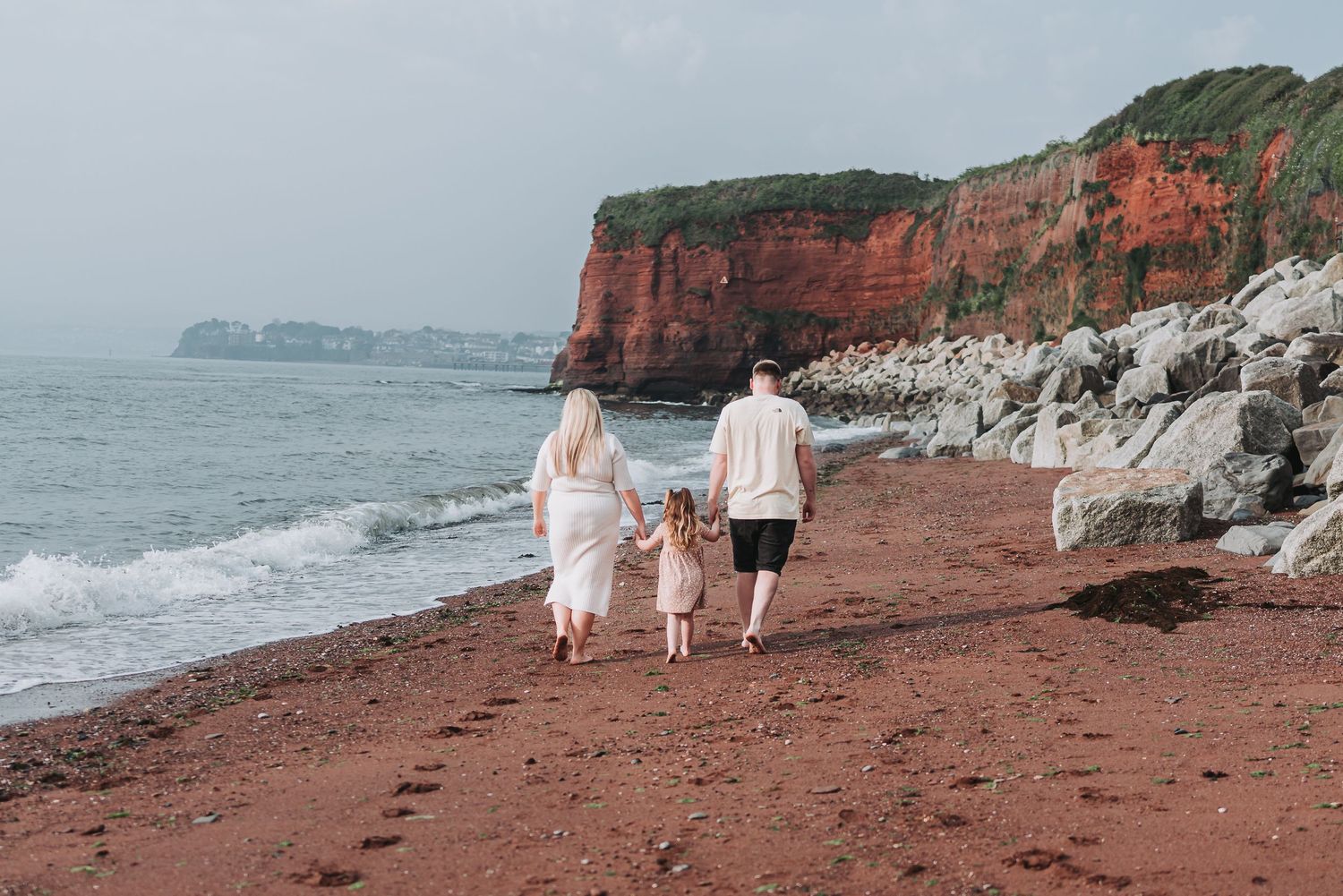 Joyful family photoshoot at Paignton, capturing beautiful moments of connection and love by the seaside.