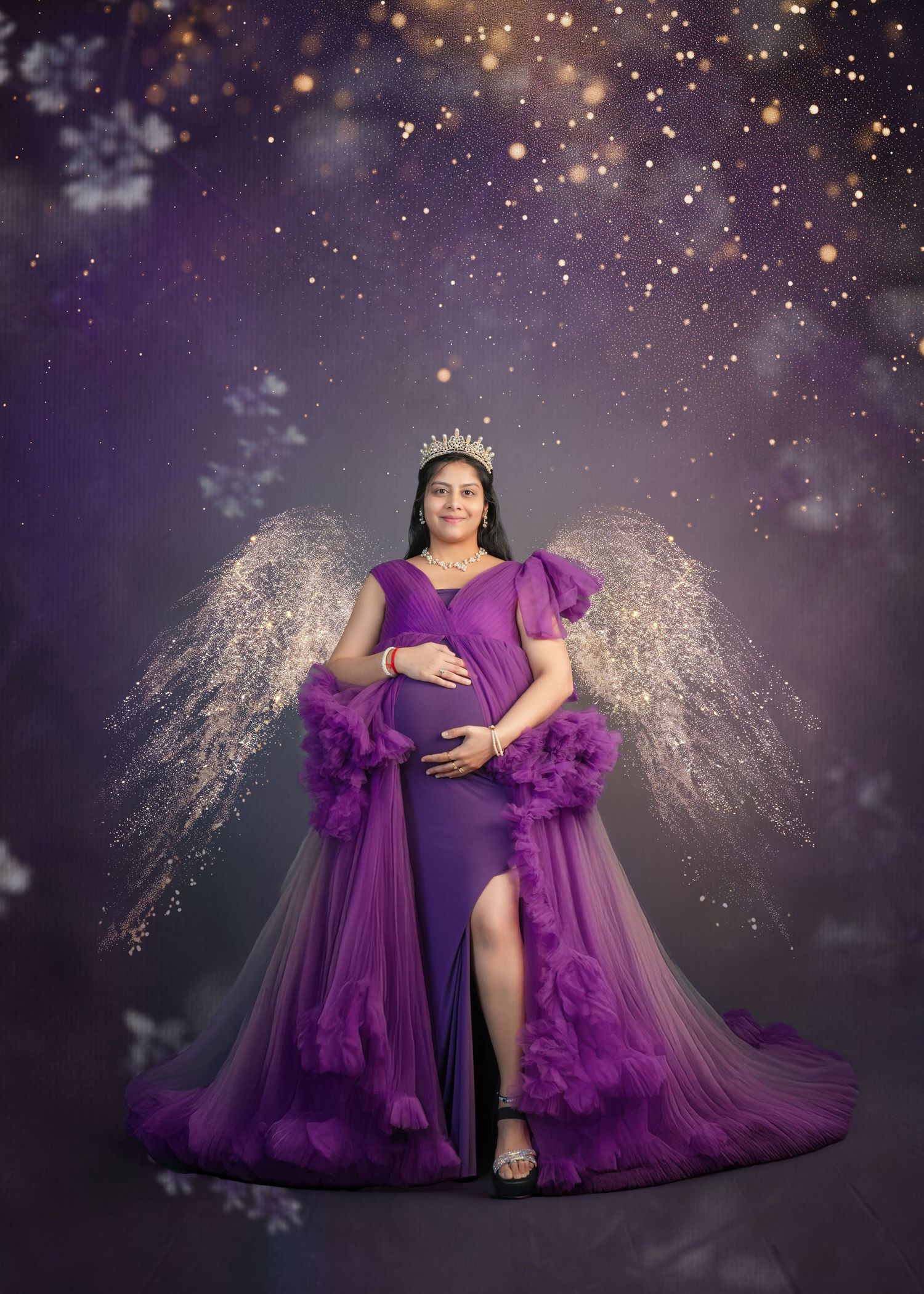 Magical maternity portrait with purple dress and sparkling light effects.