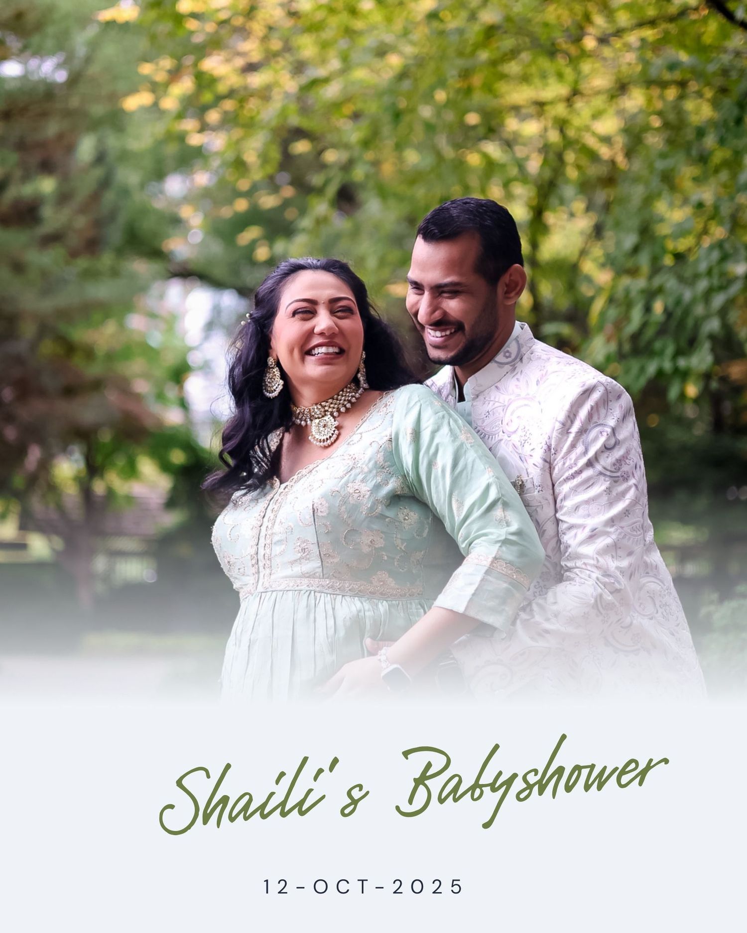 Outdoor maternity photoshoot with couple in traditional attire against autumn foliage.
