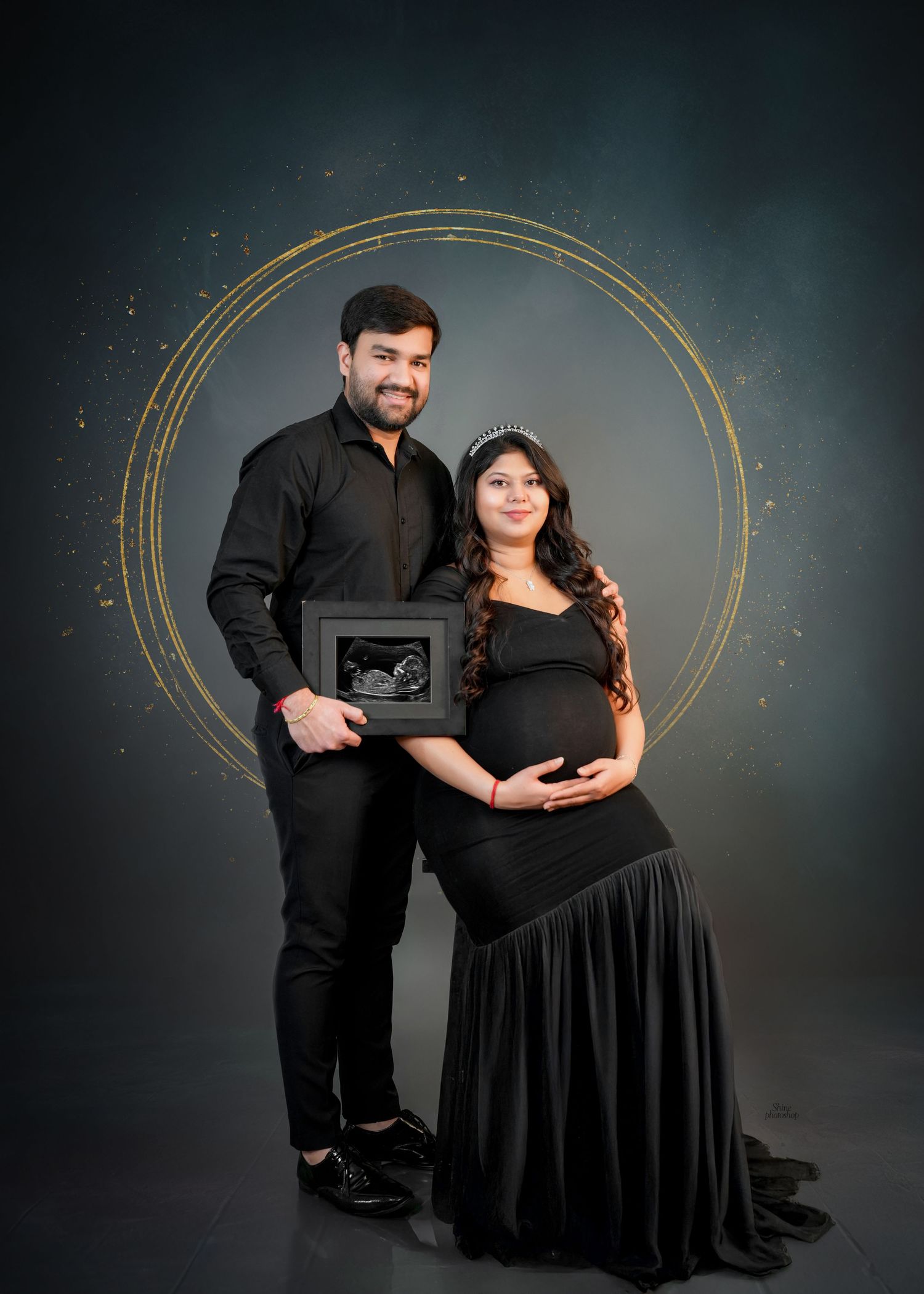 Elegant maternity portraits with golden circular designs against dark background.