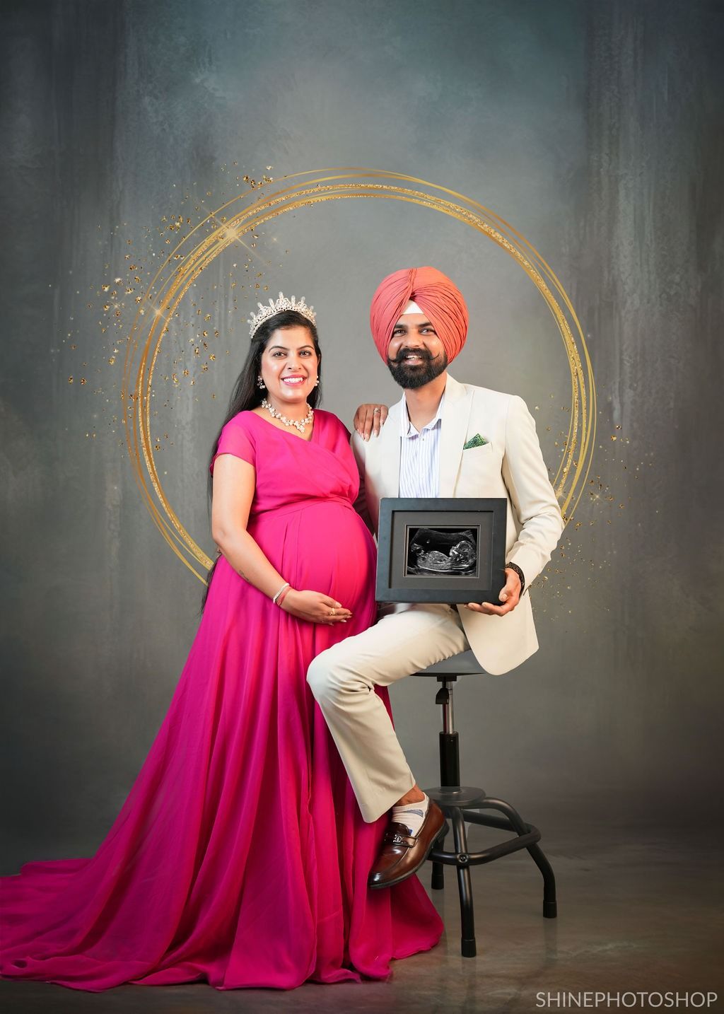 Studio maternity portraits with gold circular backdrop and professional lighting setup.