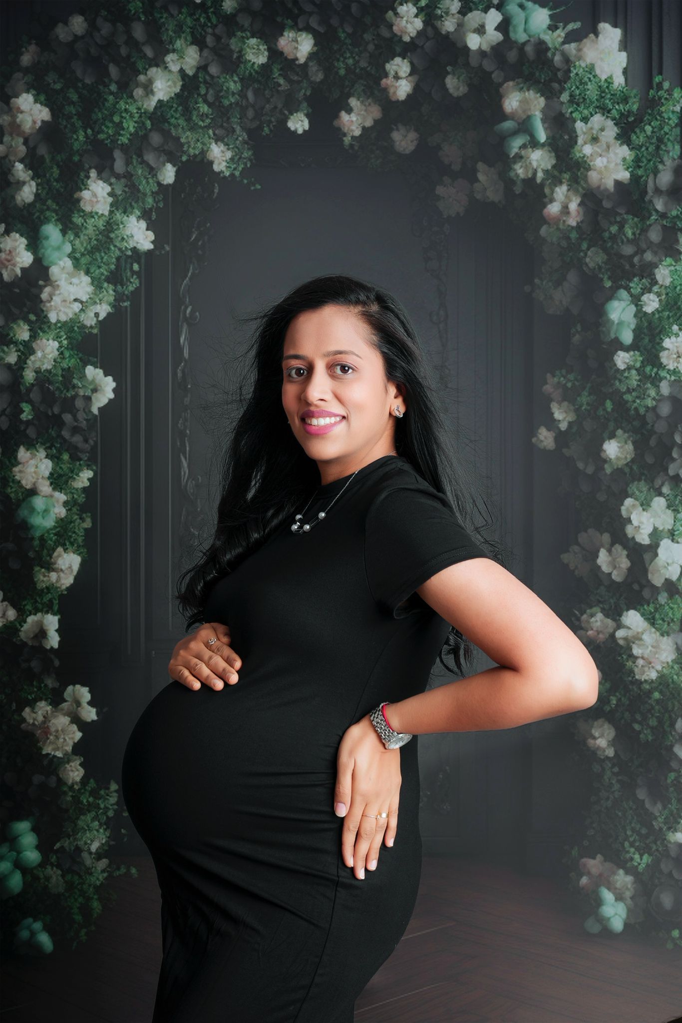 A series of artistic portraits against a dark backdrop with white floral decorations.