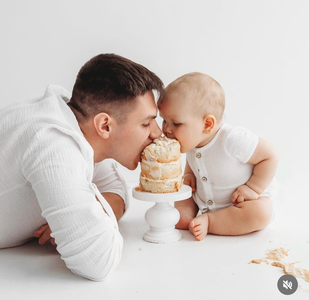 Creative father and baby photo with pancakes against white background.