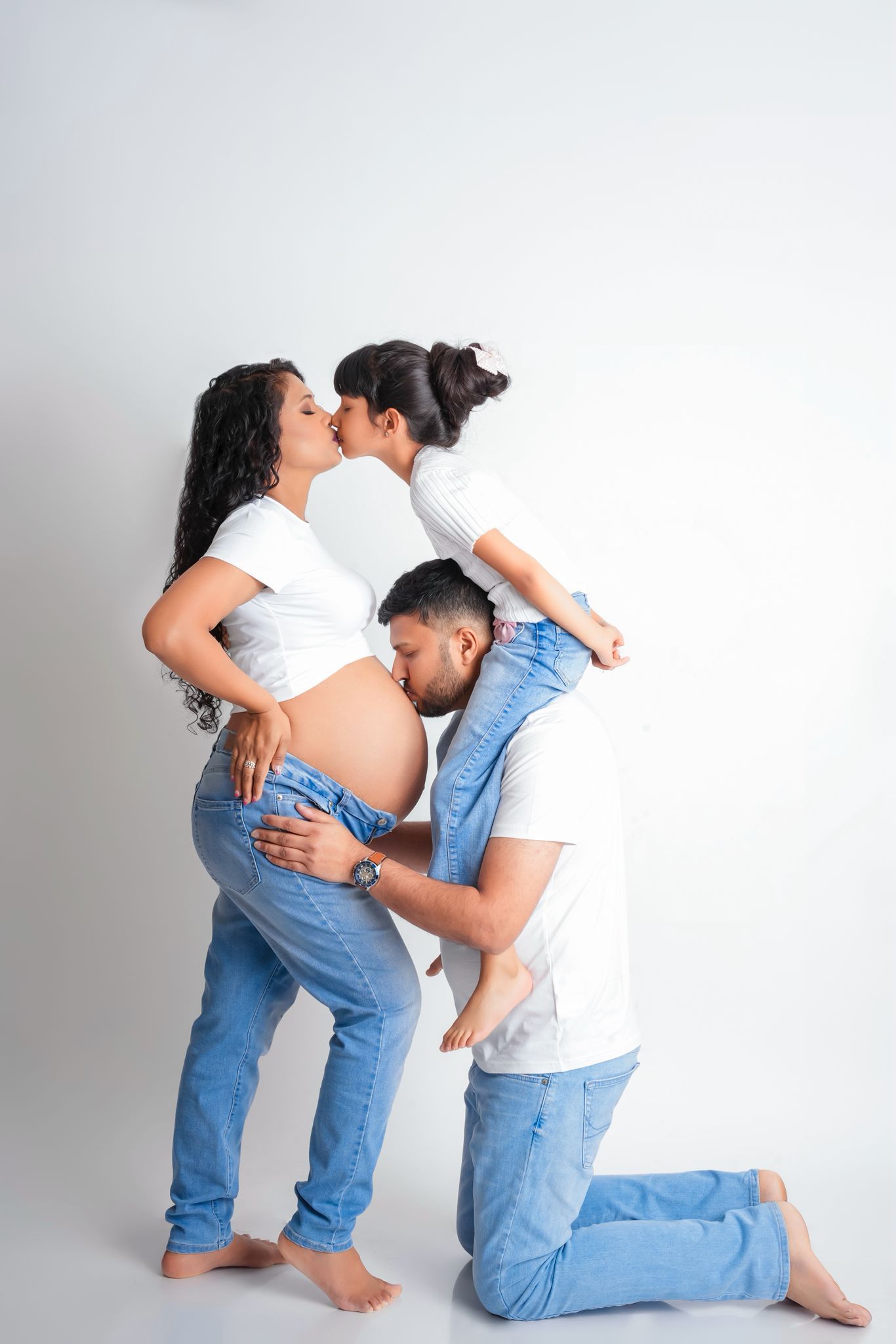 Maternity photo sequence showing couple in casual outfits against white background sharing intimate moments.