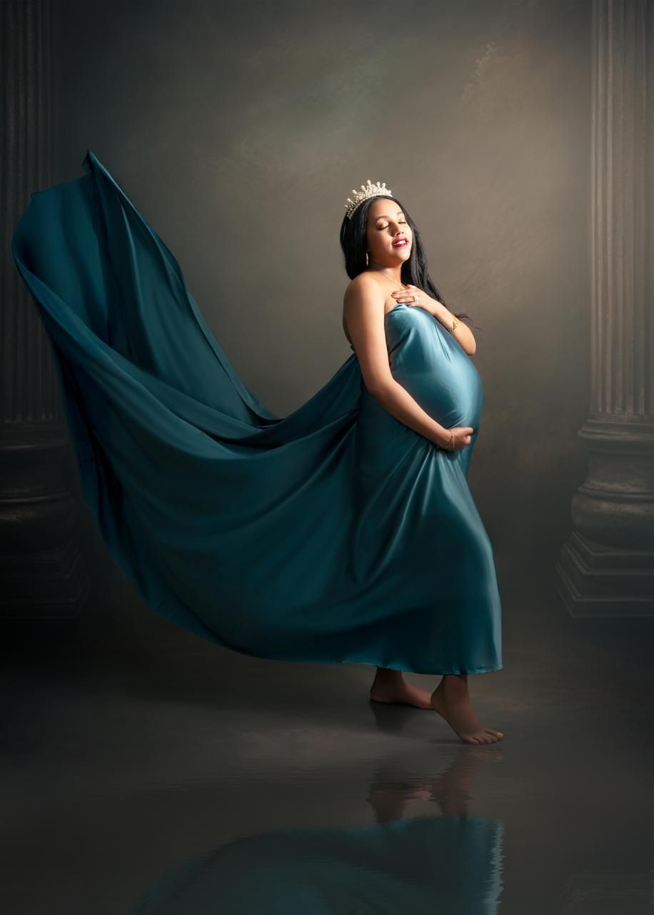 A flowing teal dress creates a dynamic motion effect in a series of artistic maternity photos against a dark background.