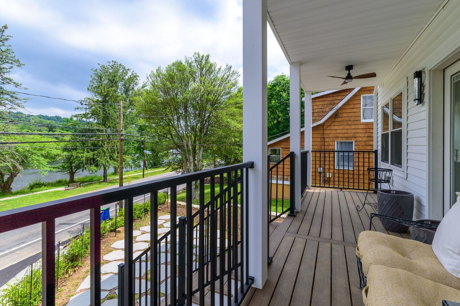 Long deck with black metal railings offering panoramic views of the surrounding landscape.