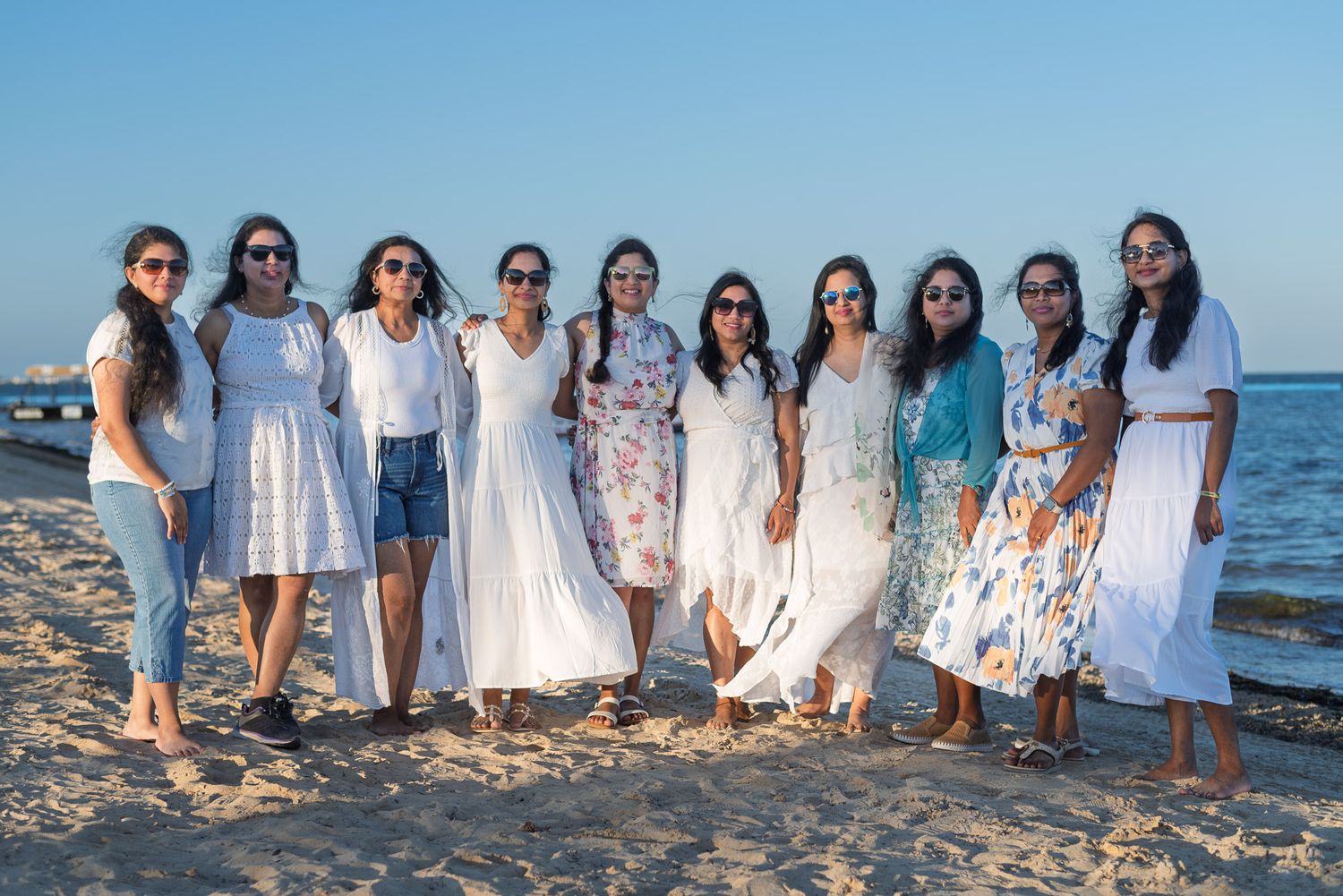 Group portrait, beautiful ladies on the beach at sunset. Jersey shore, NJ