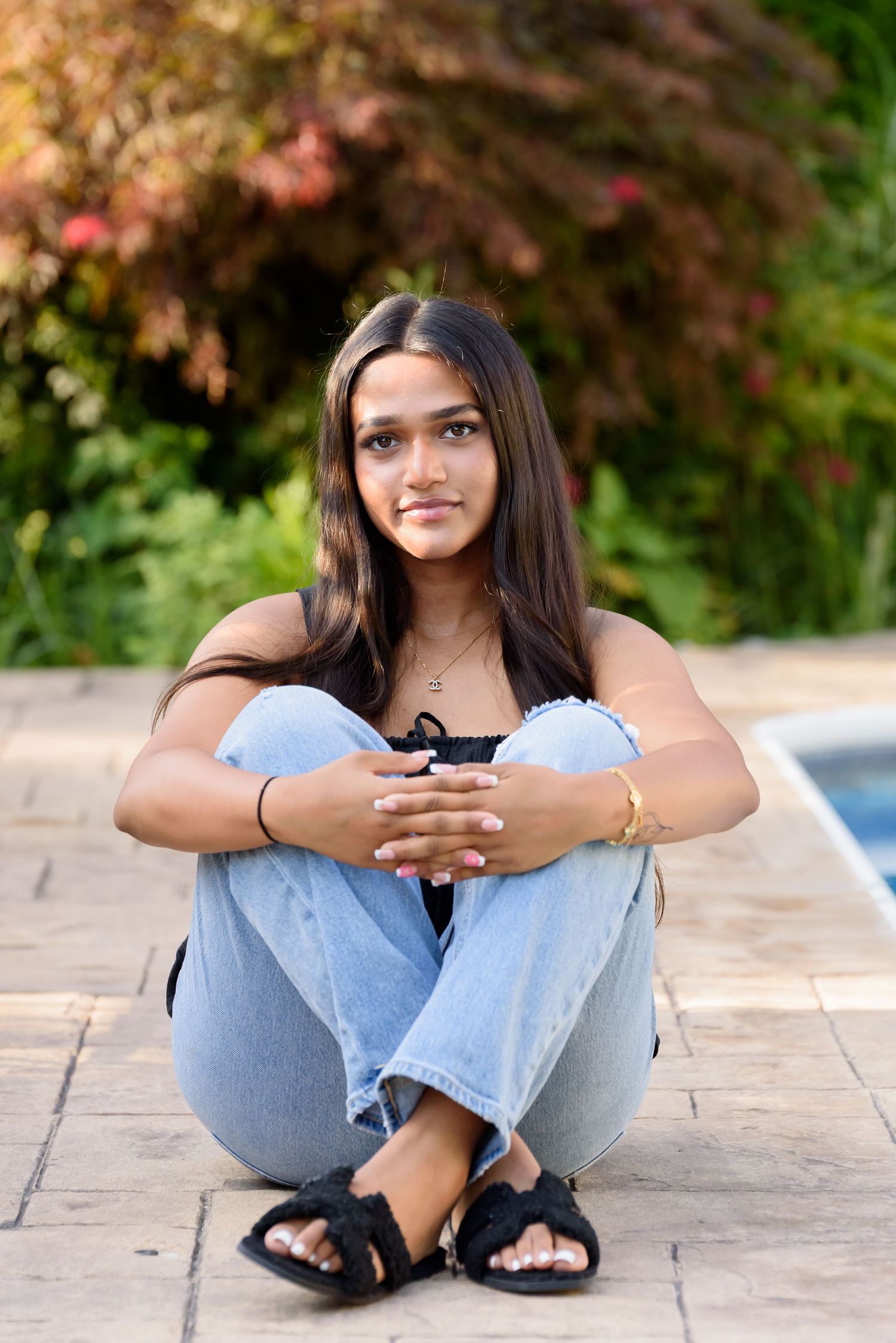 High school senior portraits photoshoot. Backyard photos by the side of pool in Mount Laurel, NJ.