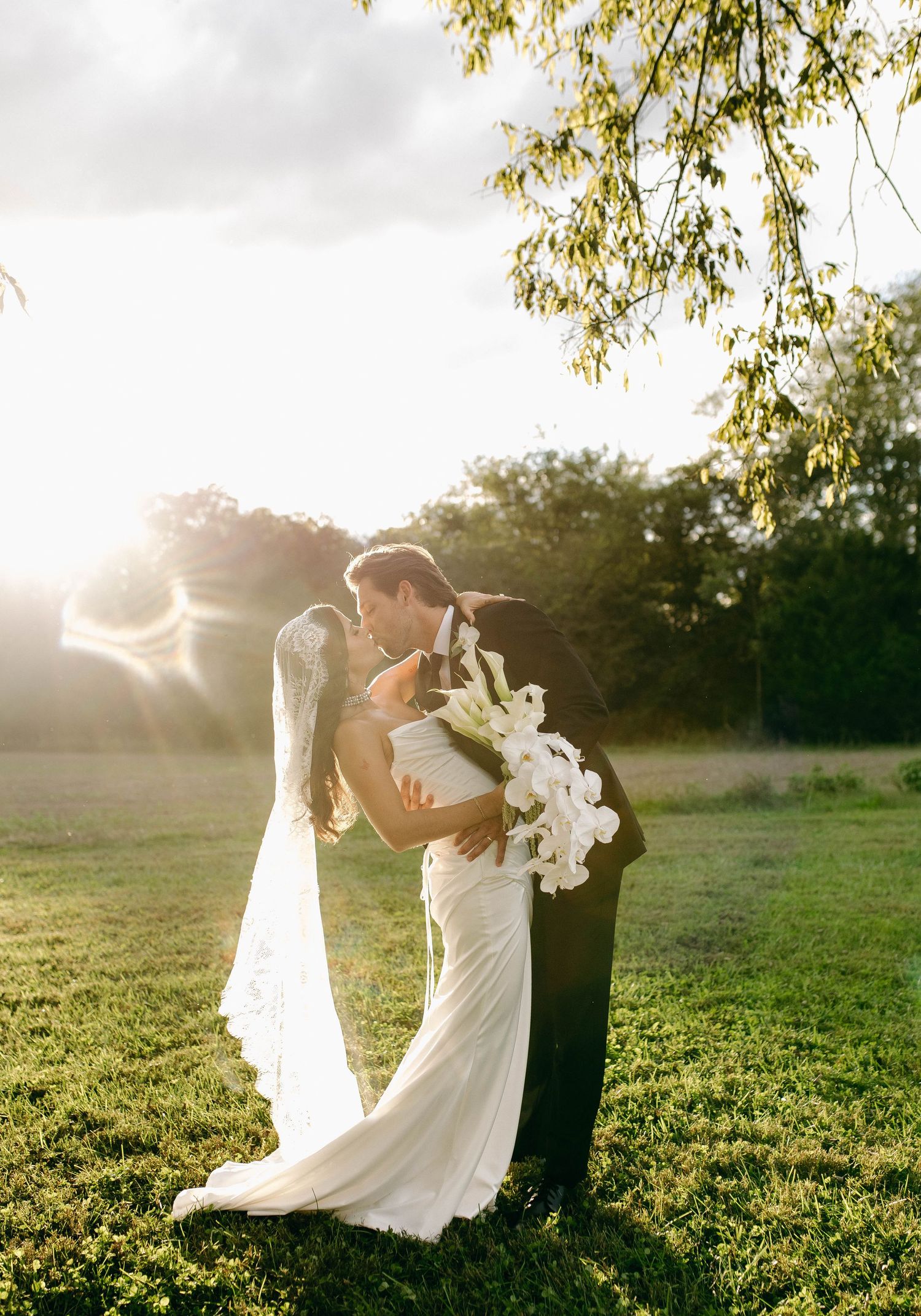 A bride and groom posing for their luxury photographer during their wedding day in Nashville, TN