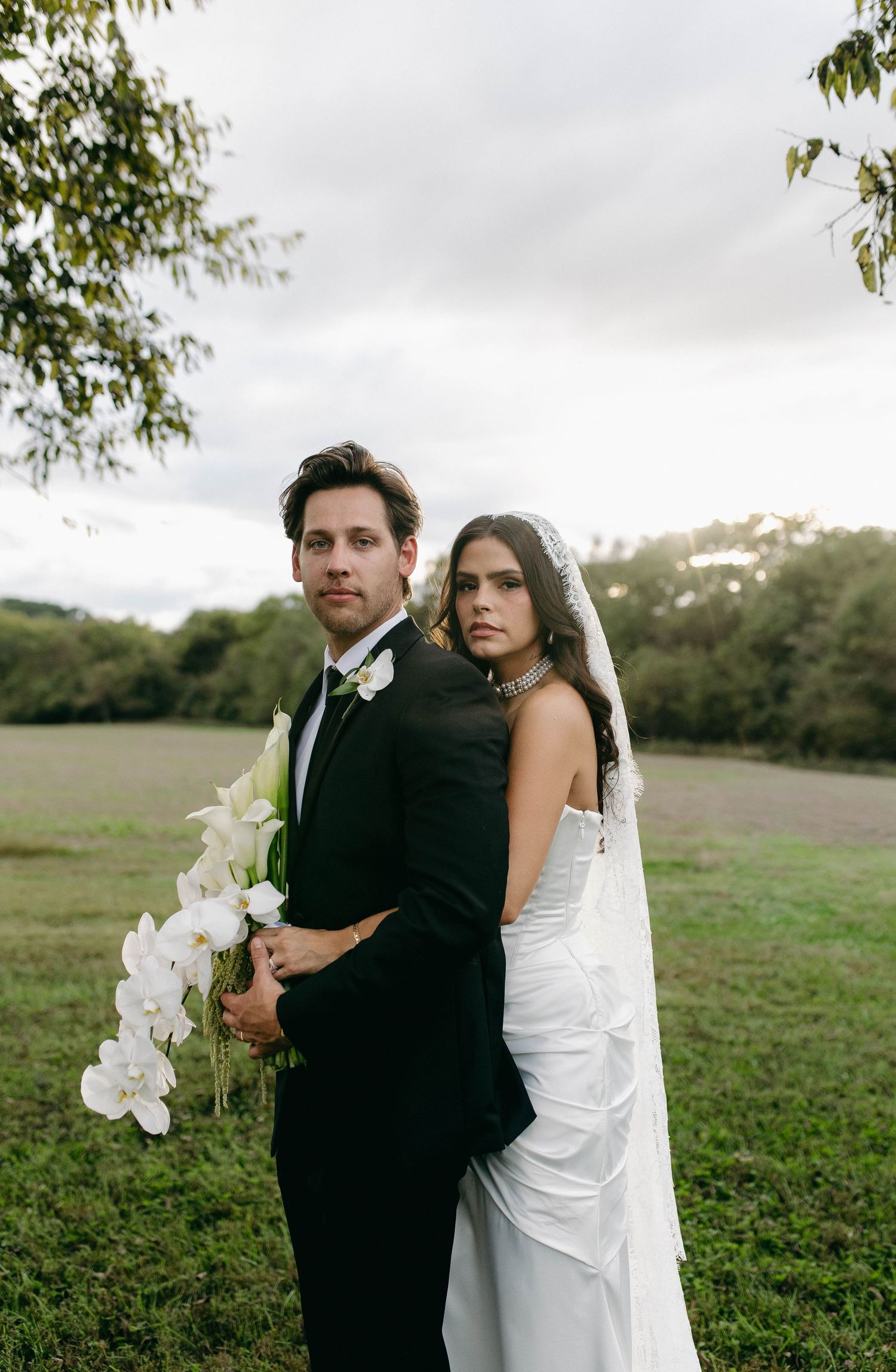 A bride and groom posing for their luxury photographer during their wedding day in Nashville, TN