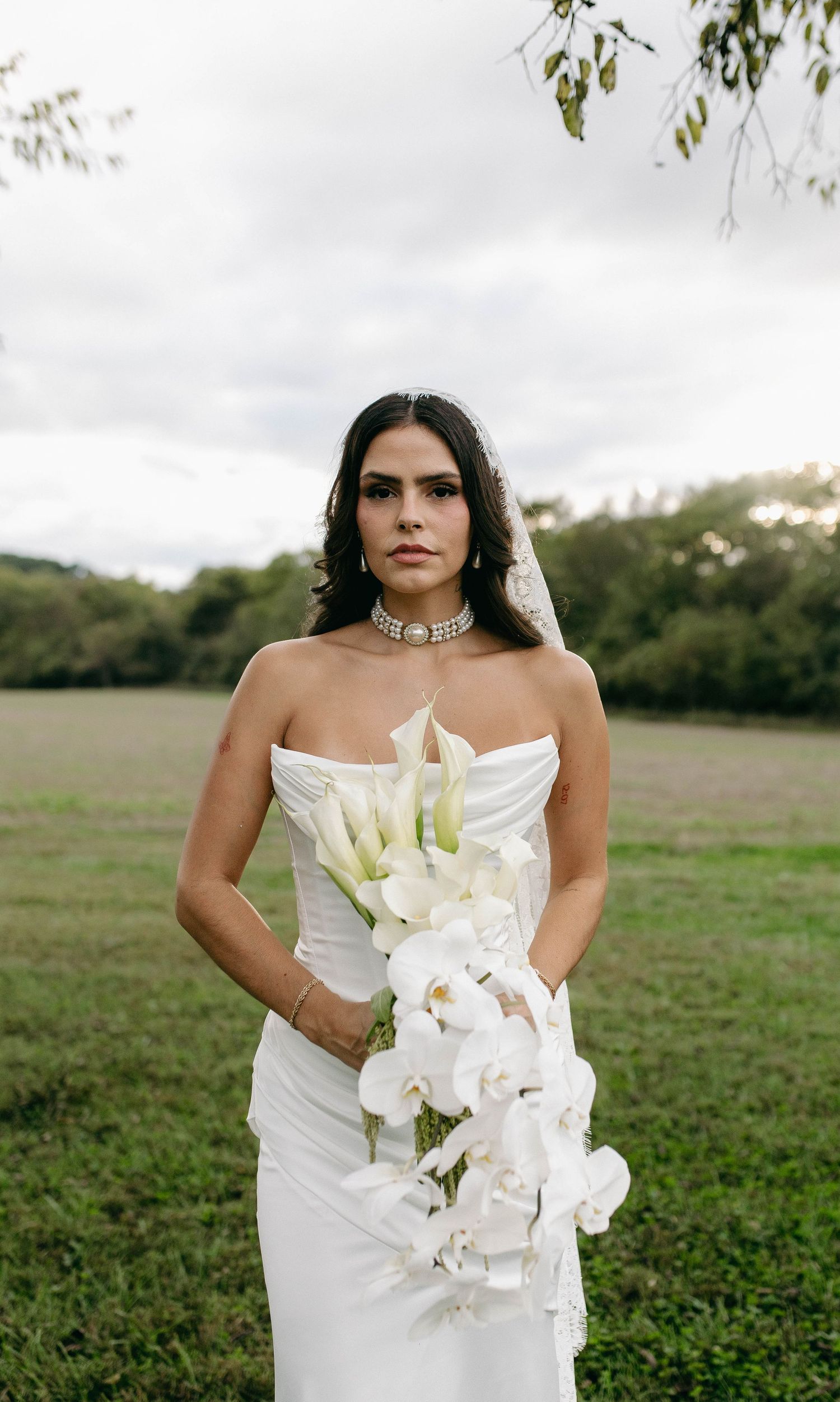 A bride and groom posing for their luxury photographer during their wedding day in Nashville, TN