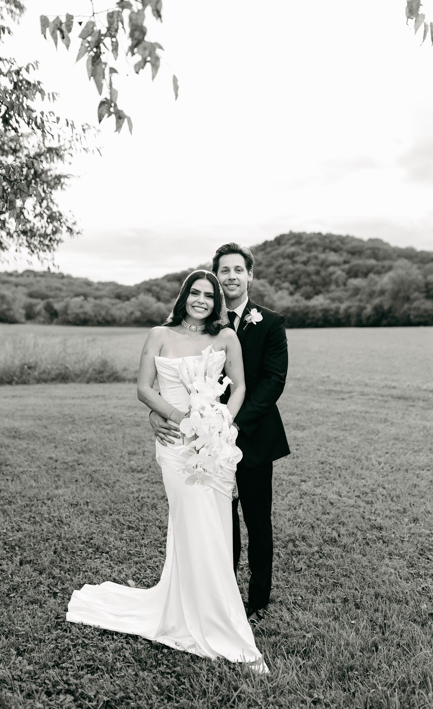 A bride and groom posing for their luxury photographer during their wedding day in Nashville, TN