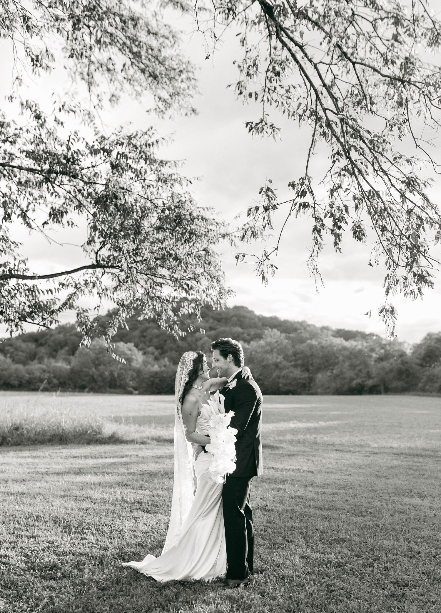 A bride and groom posing for their luxury photographer during their wedding day in Nashville, TN