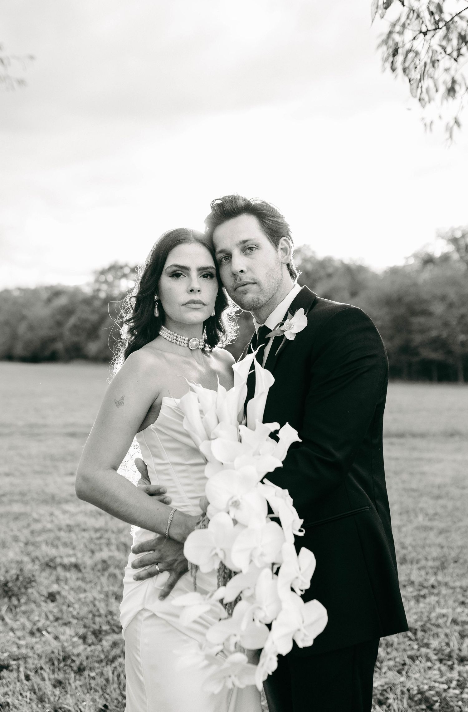 A bride and groom posing for their luxury photographer during their wedding day in Nashville, TN