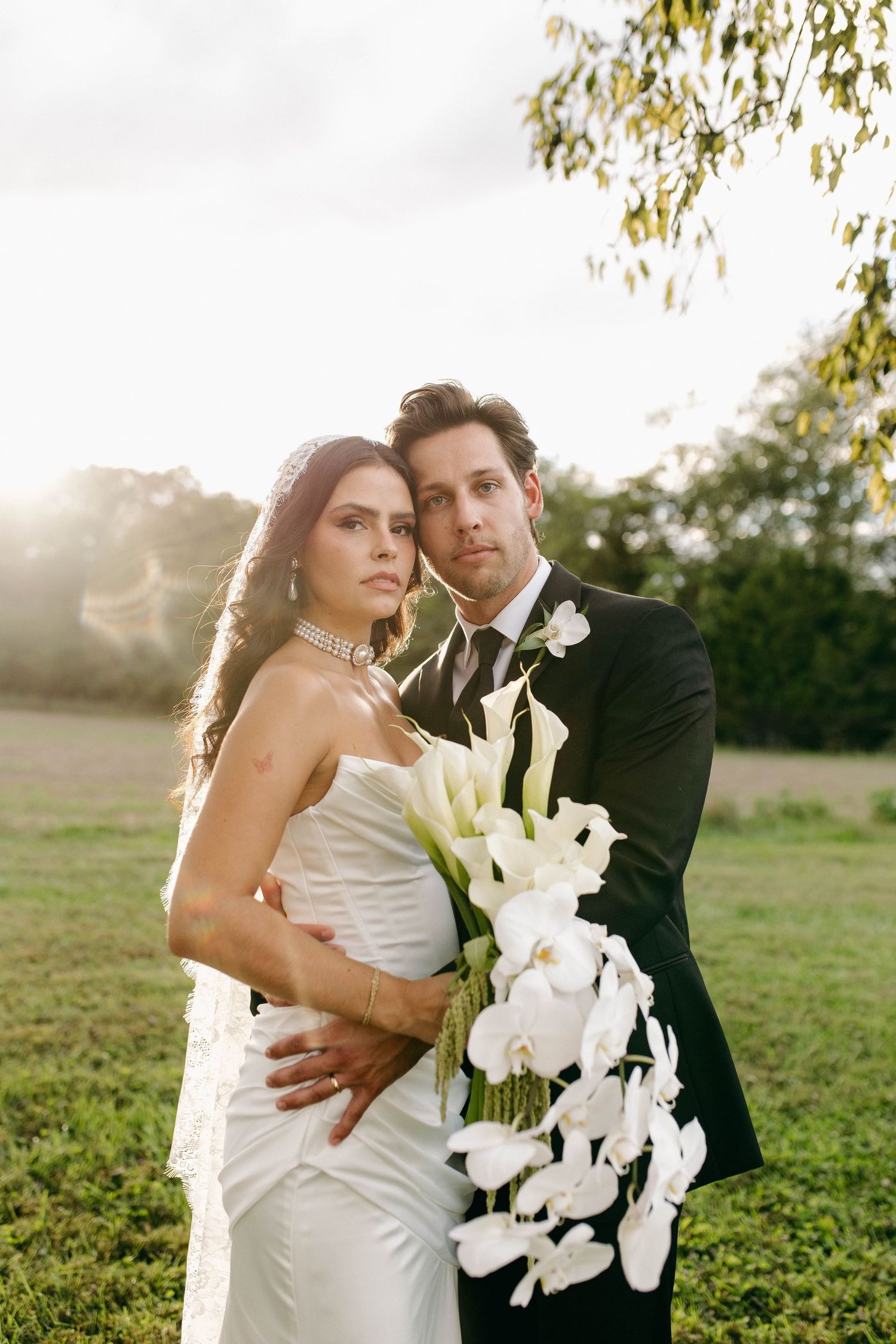 A bride and groom posing for their luxury photographer during their wedding day in Nashville, TN
