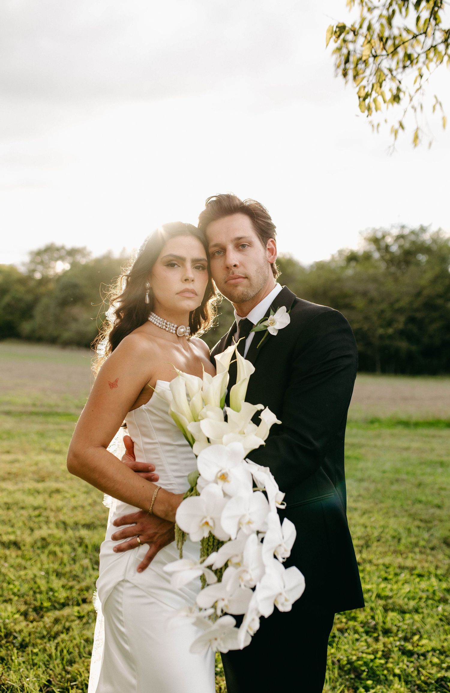 A bride and groom posing for their luxury photographer during their wedding day in Nashville, TN