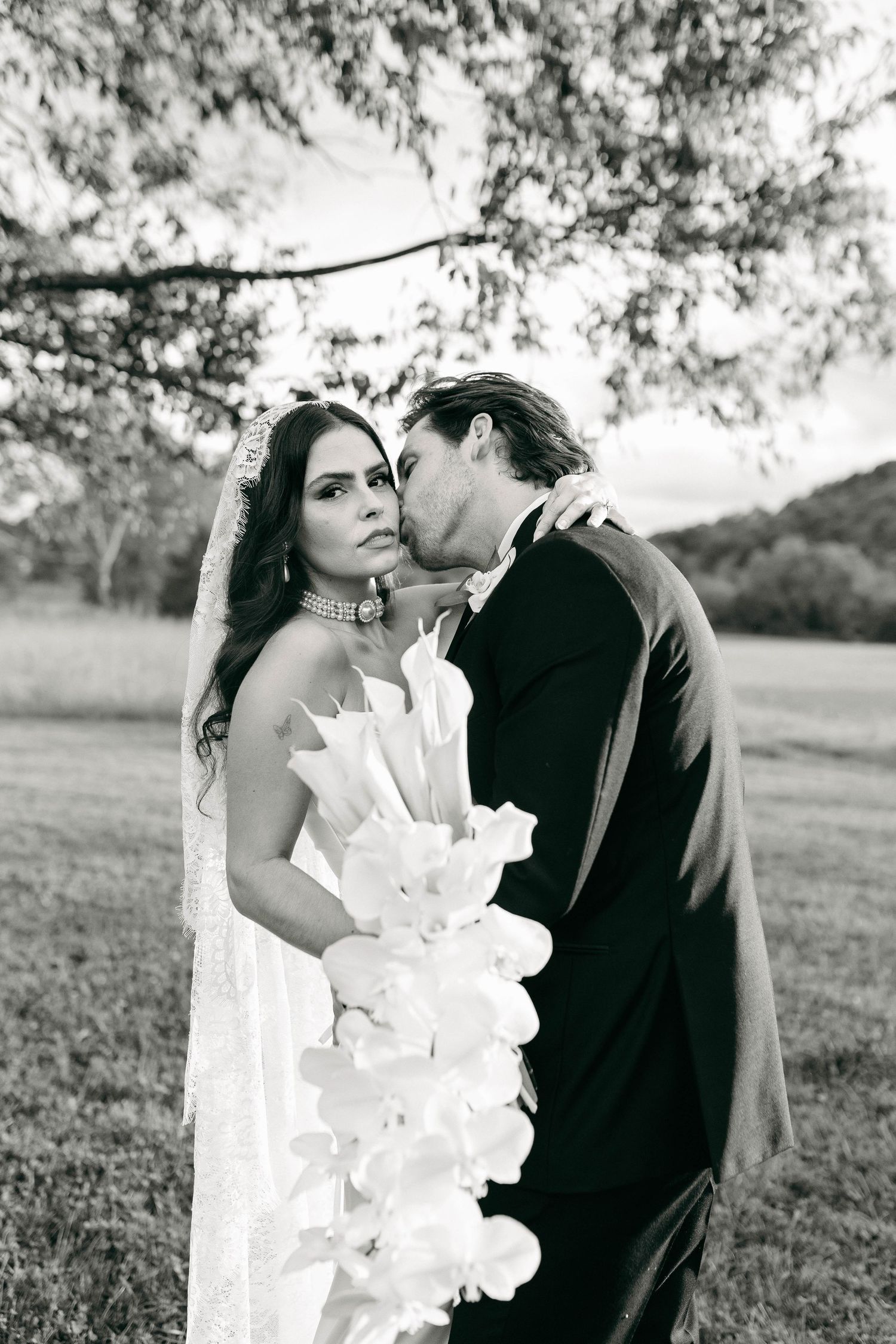A bride and groom posing for their luxury photographer during their wedding day in Nashville, TN